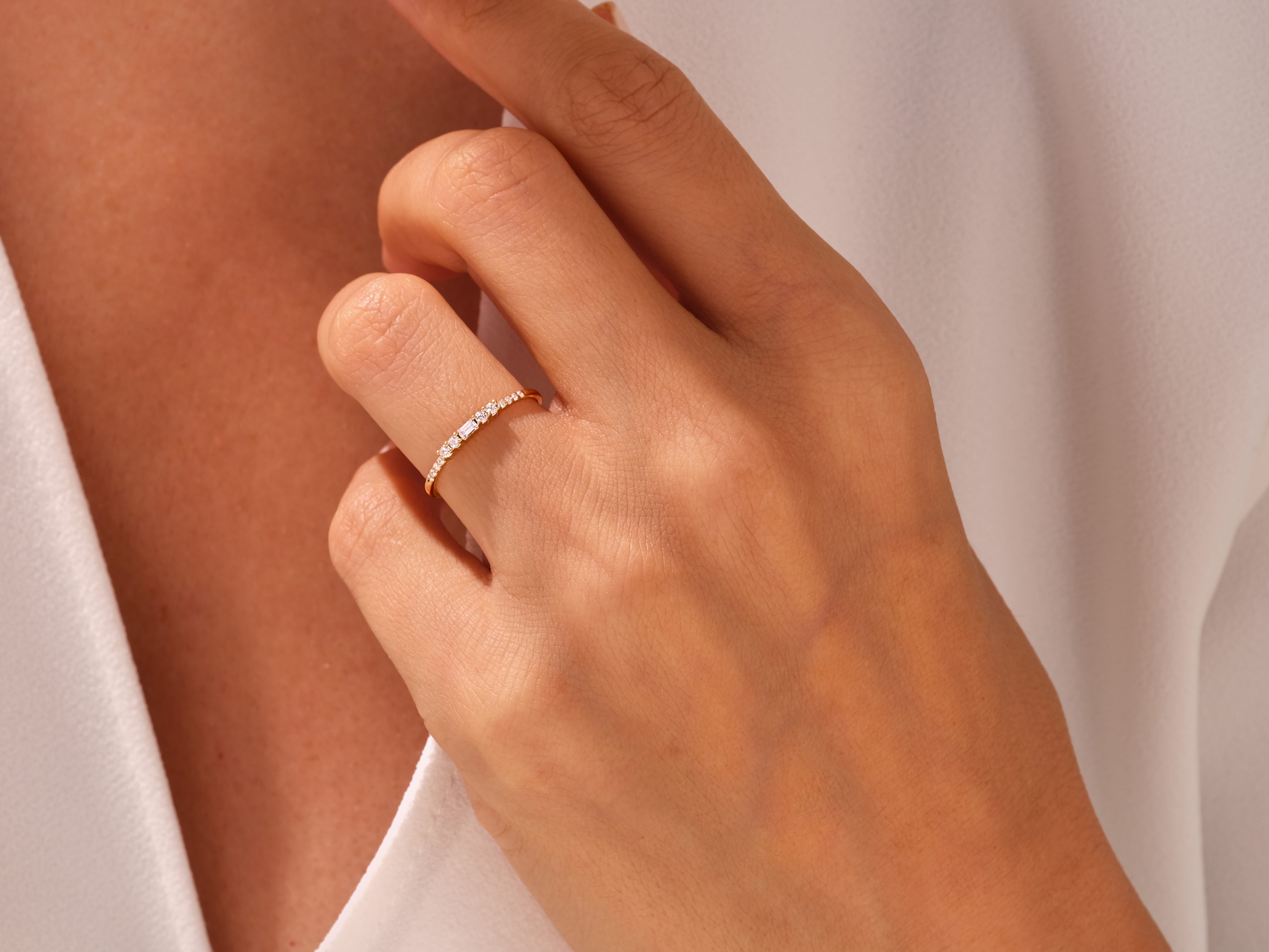 Gold diamond ring on a woman's finger, fine jewelry for sale