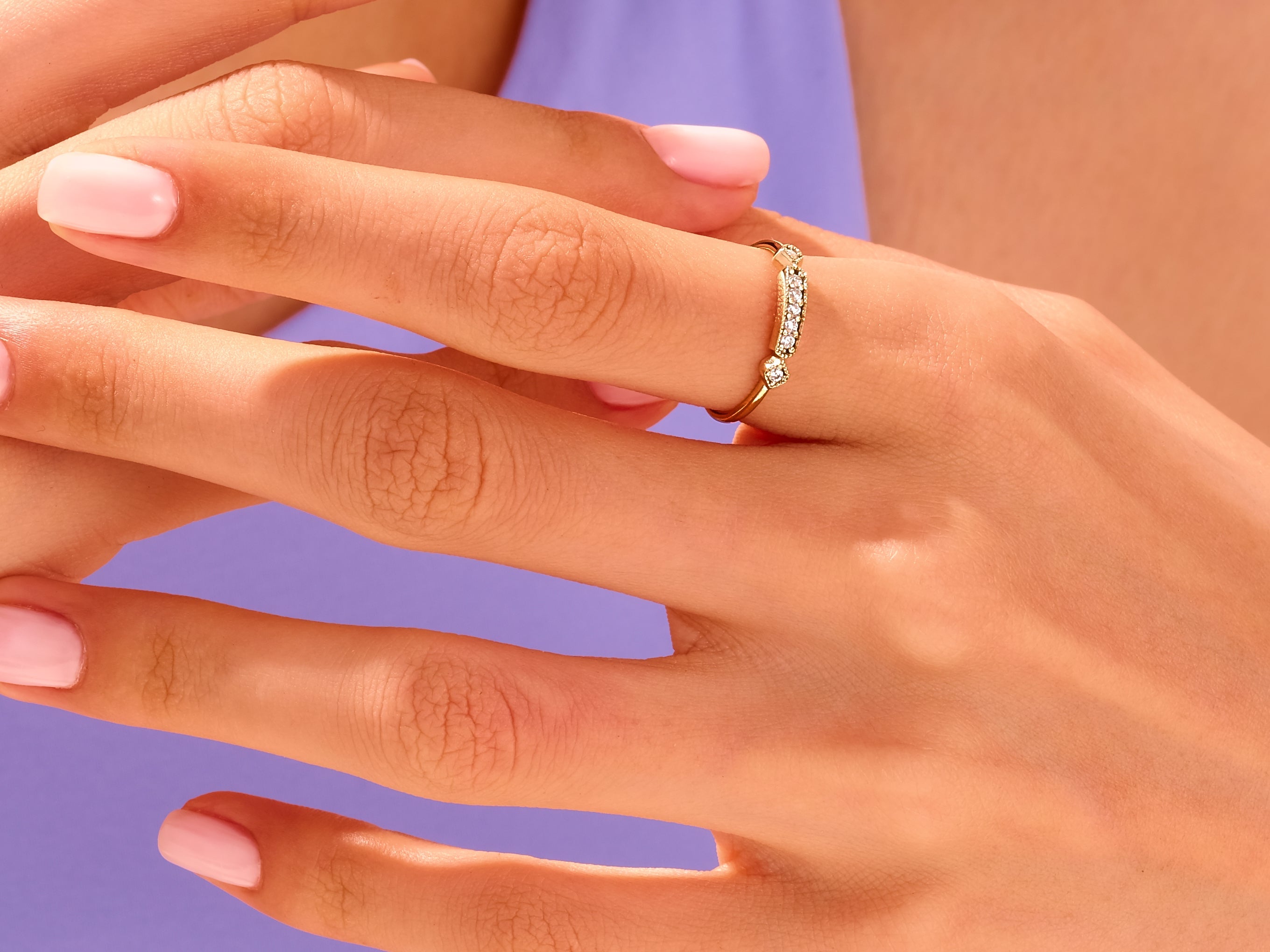 Diamond band ring on a woman's finger, jewelry product photography
