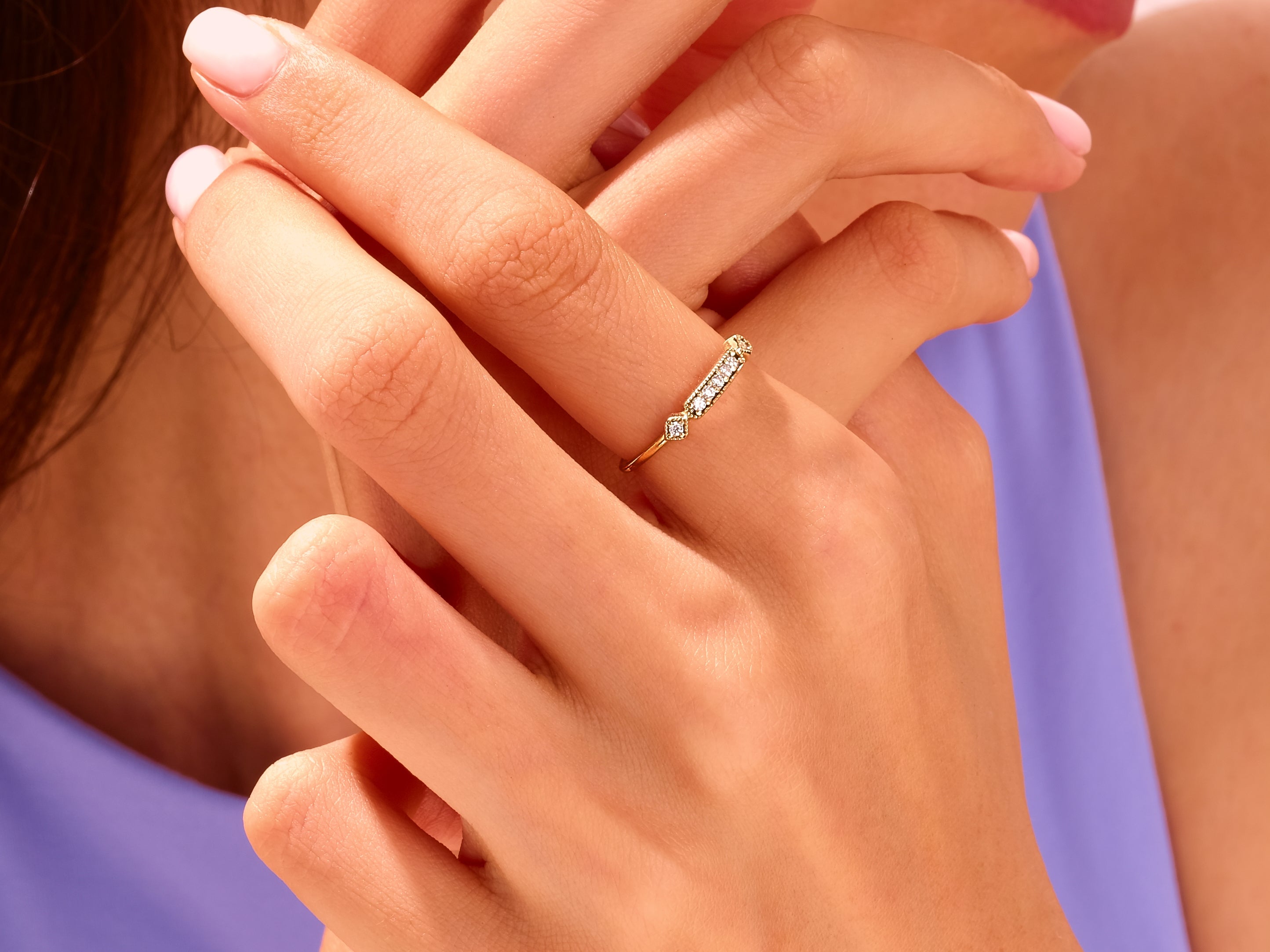 Diamond and gold ring on a woman's hand