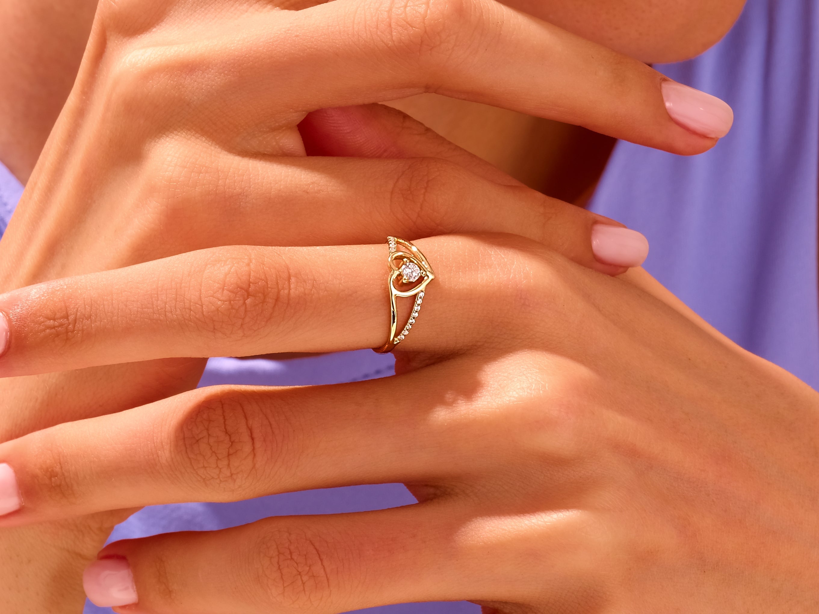 Gold diamond ring on a woman's finger, jewelry photography