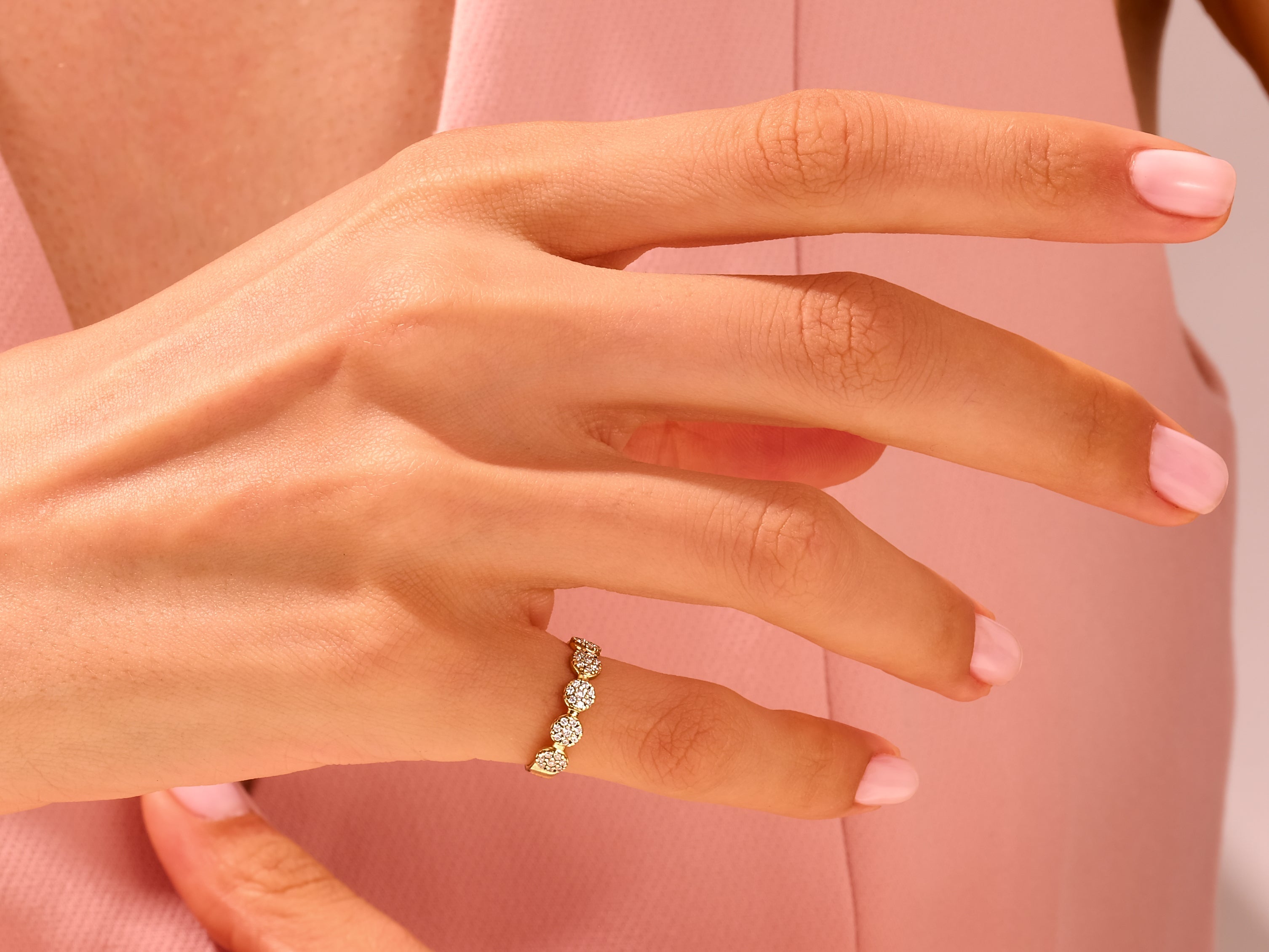 Diamond cluster ring on a hand, jewelry photography