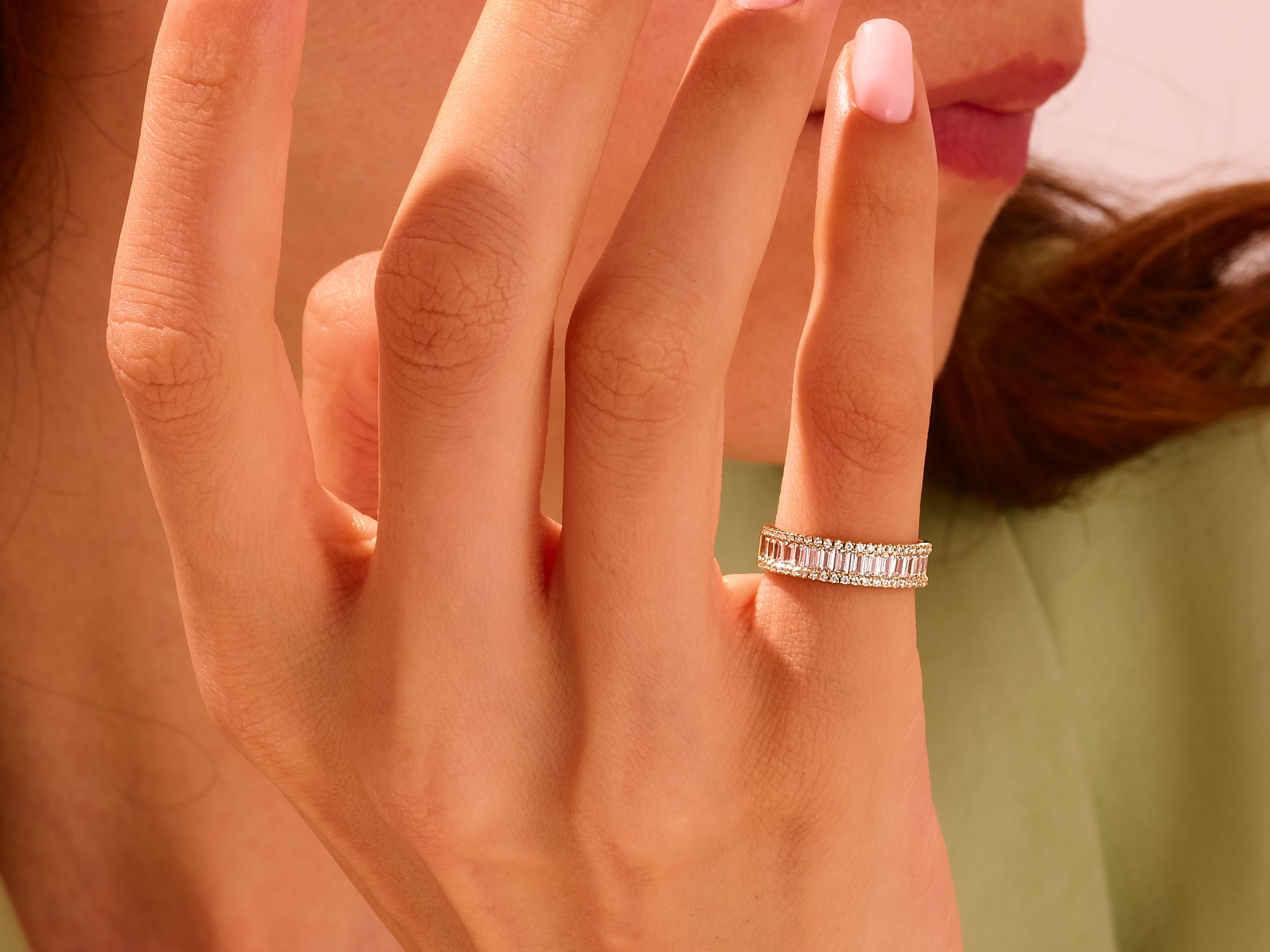 Diamond baguette eternity ring on a woman's finger