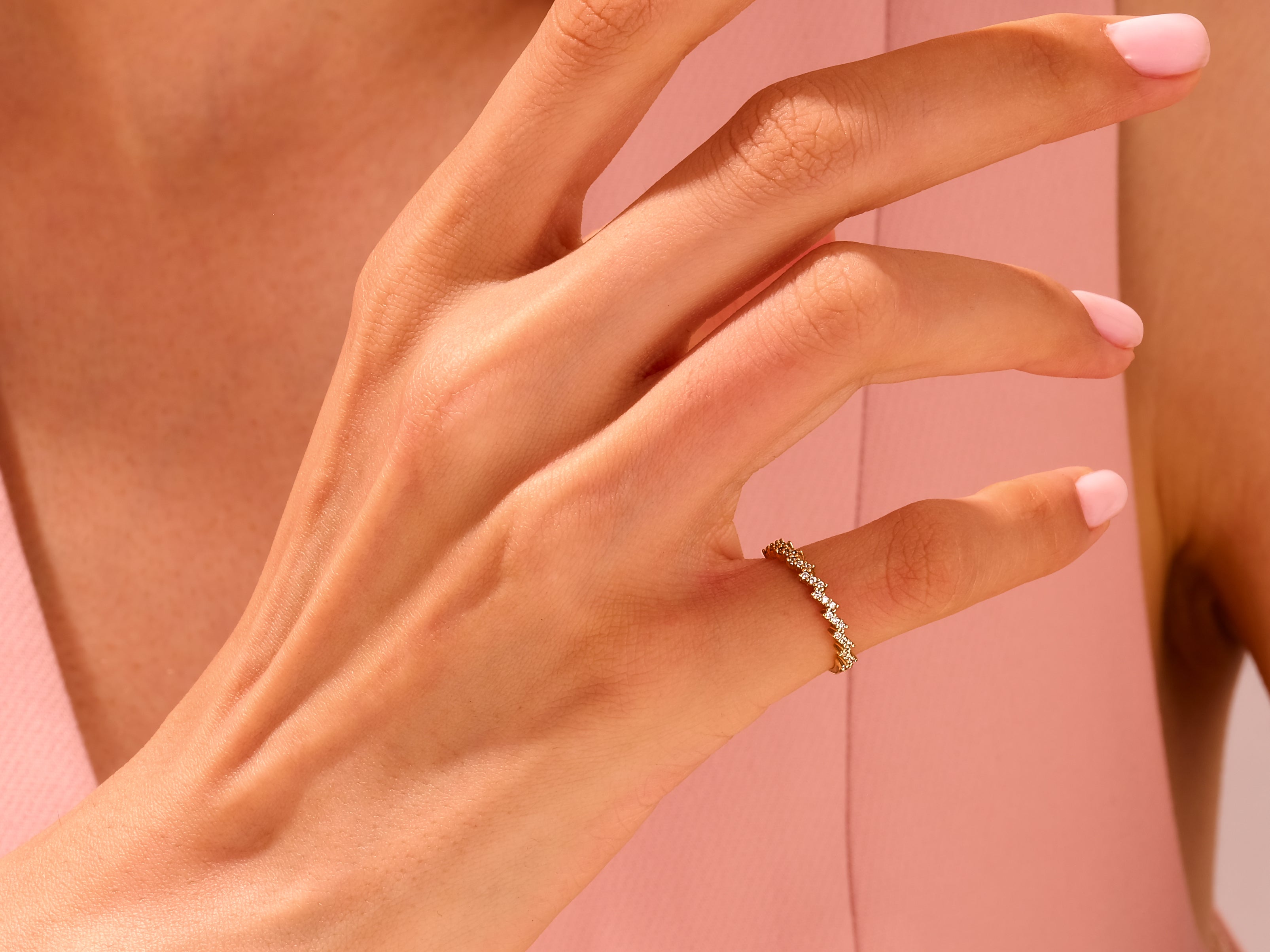 Diamond zigzag ring on a hand, jewelry product photography
