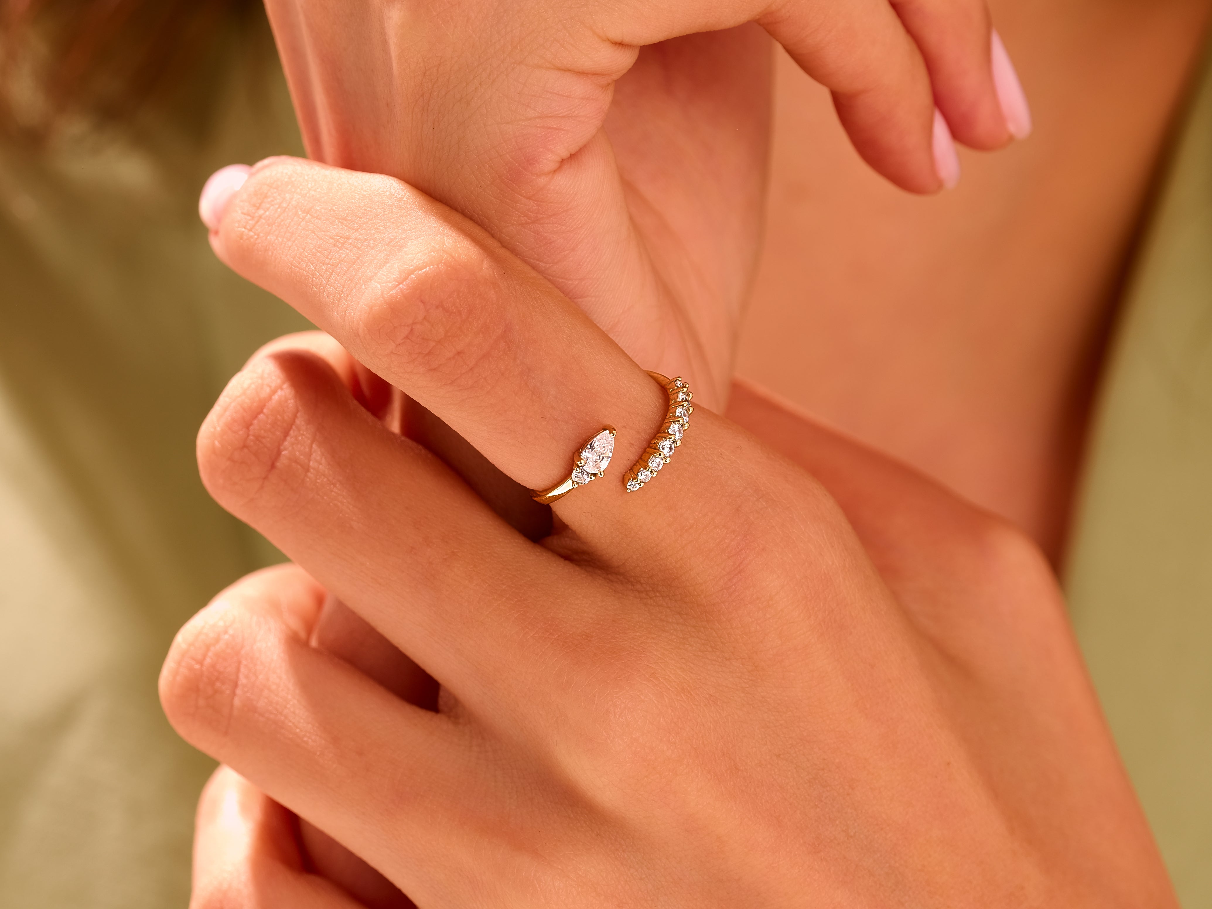 Gold diamond ring on hand, elegant jewelry for women