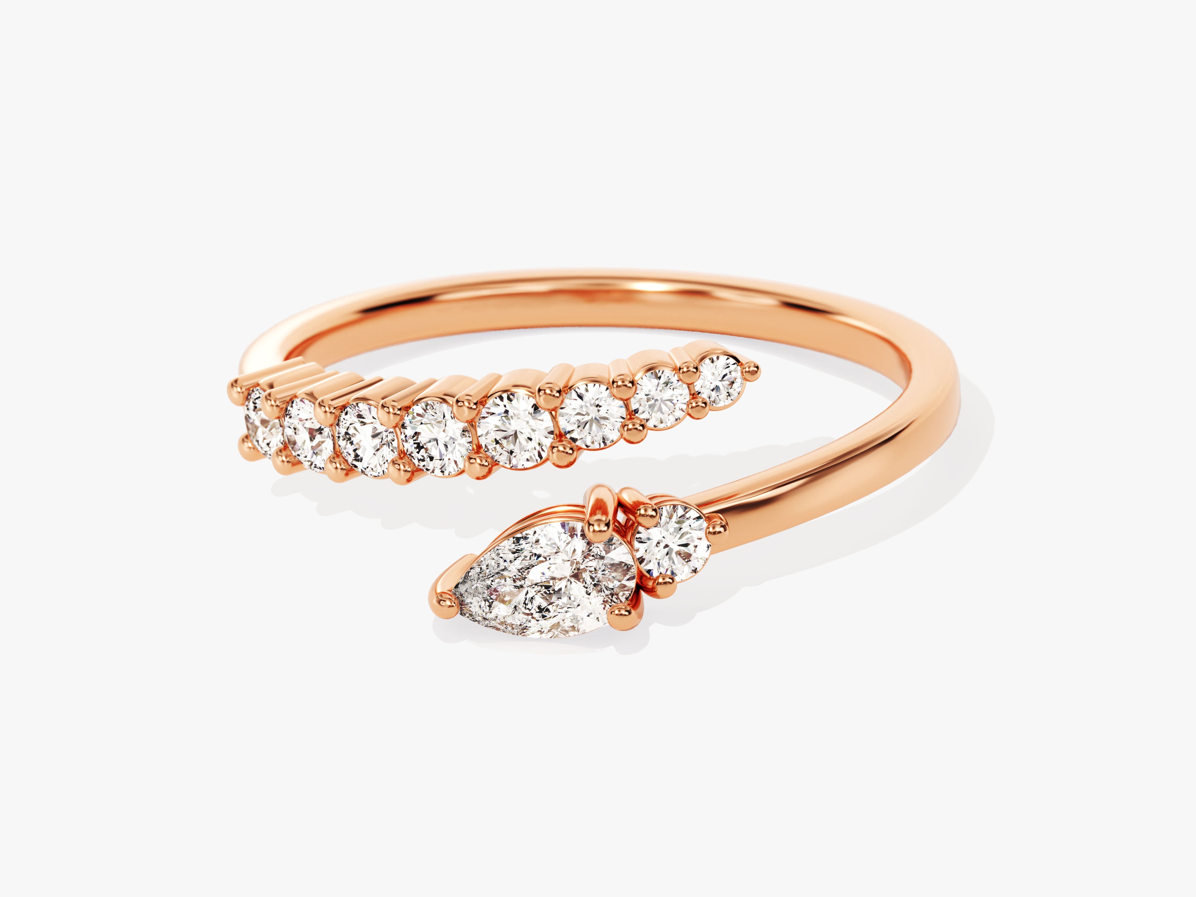 Rose gold diamond bypass ring with pear-shaped center stone