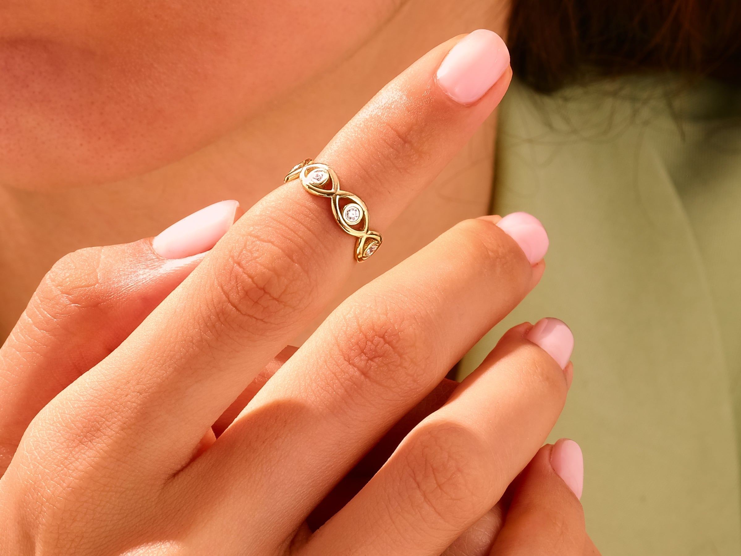 Gold diamond ring on finger, elegant jewelry for women