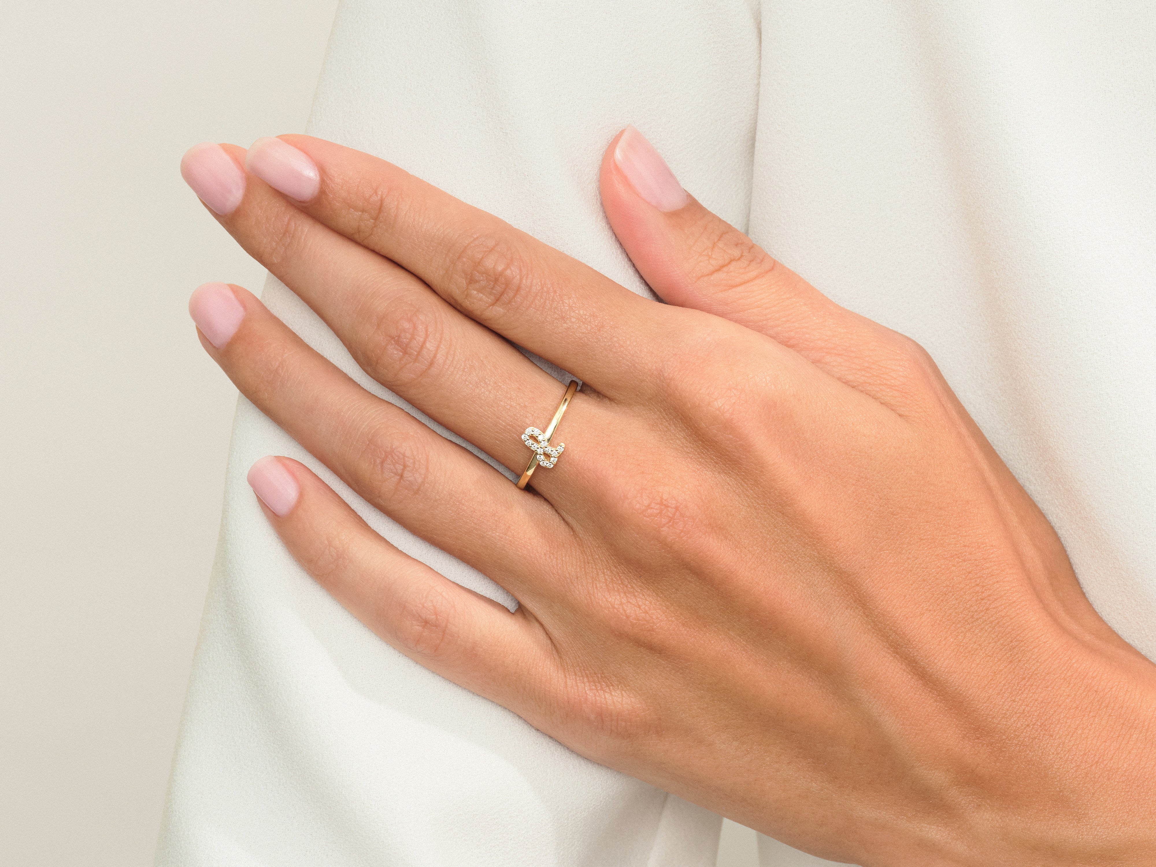 Diamond butterfly ring on a woman's hand