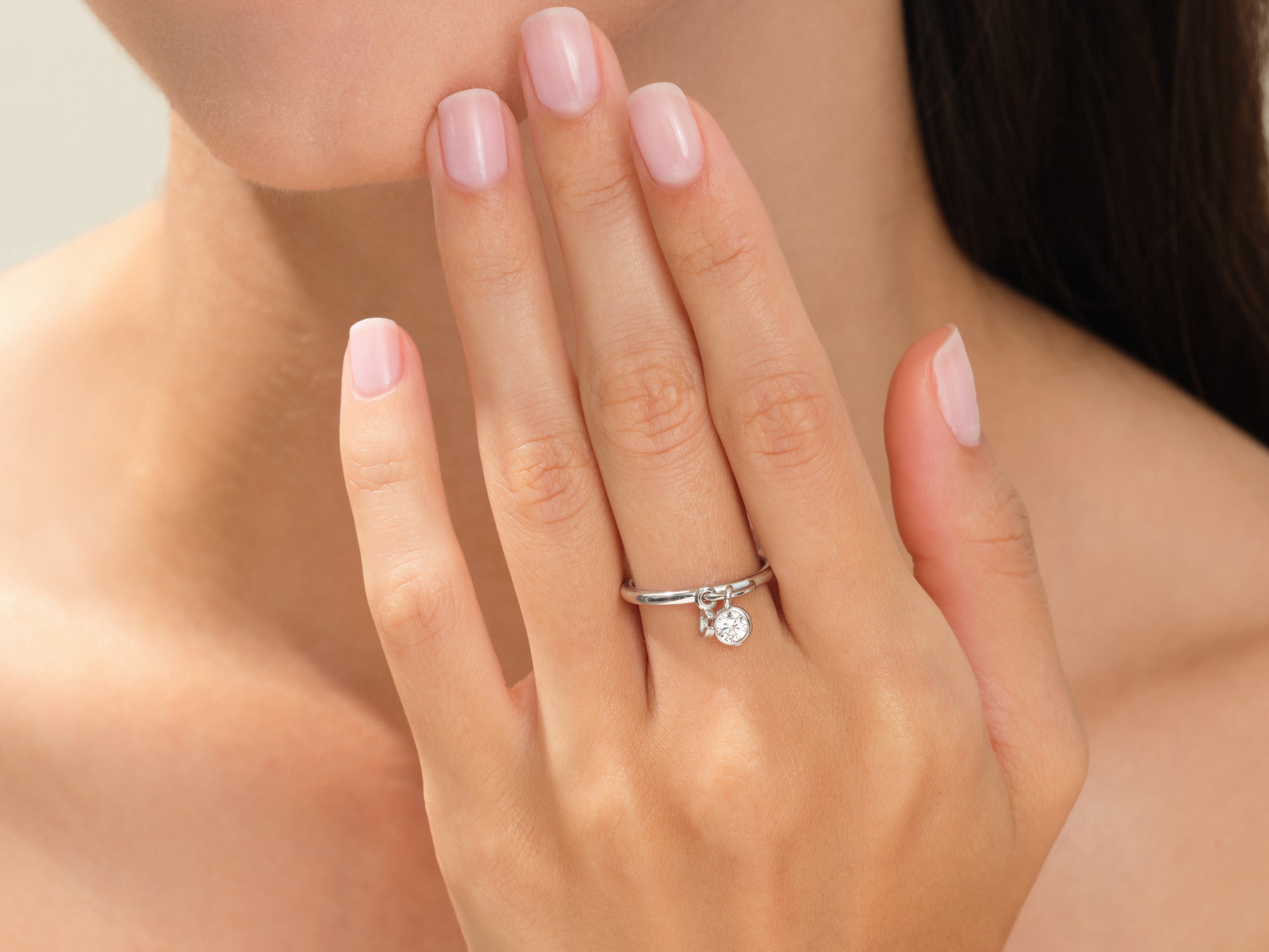 Diamond charm ring on a woman's hand, fine jewelry for sale