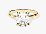 Oval diamond engagement ring in yellow gold setting