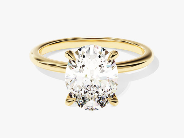 Oval diamond engagement ring in yellow gold setting