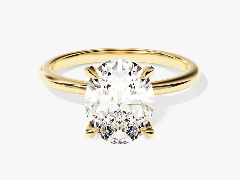 Oval diamond engagement ring in yellow gold setting