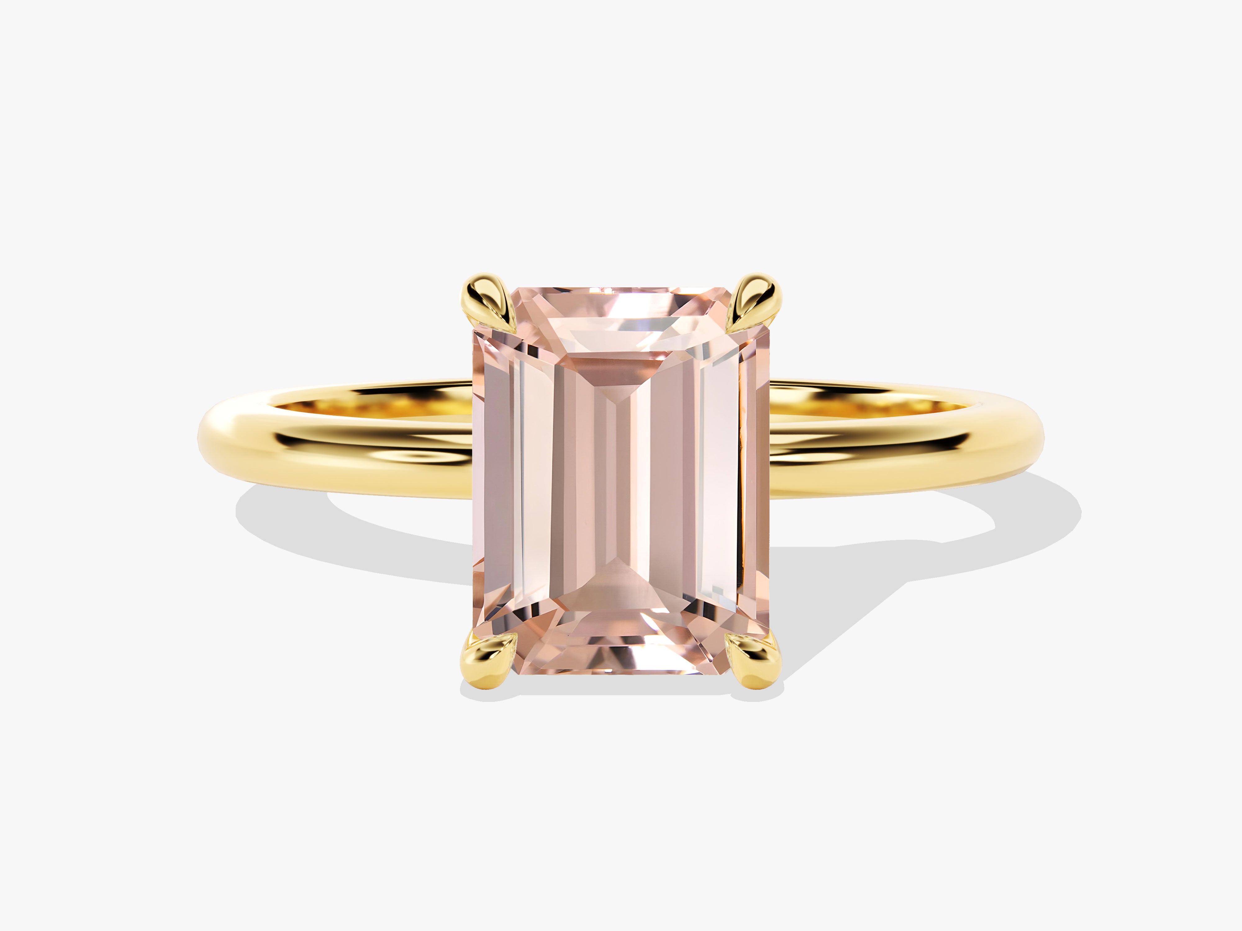 Emerald cut morganite ring in yellow gold setting