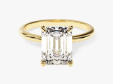 Emerald cut diamond ring in yellow gold setting