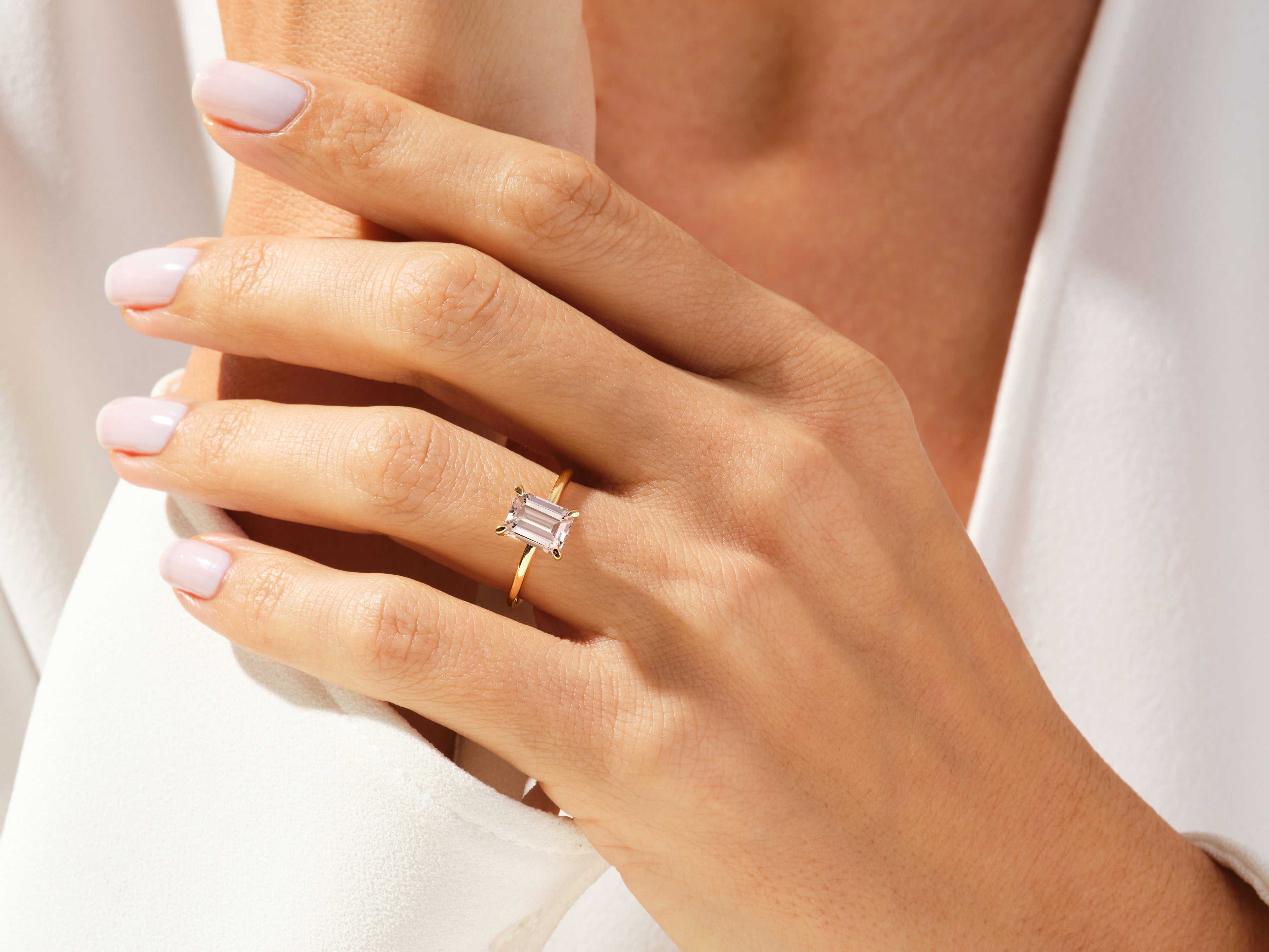 Emerald cut diamond ring on a woman's hand