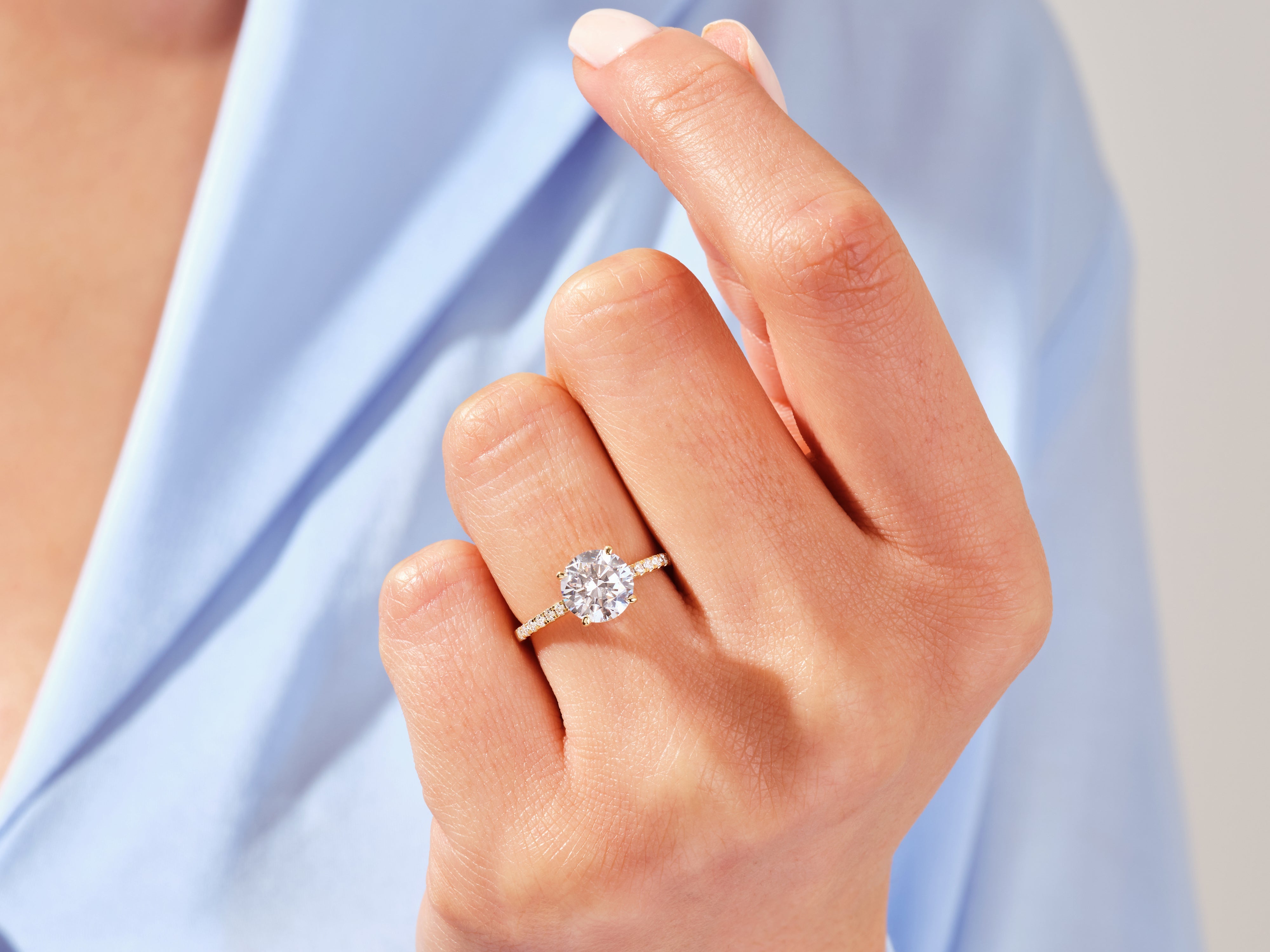 Diamond engagement ring on a woman's hand, jewelry product