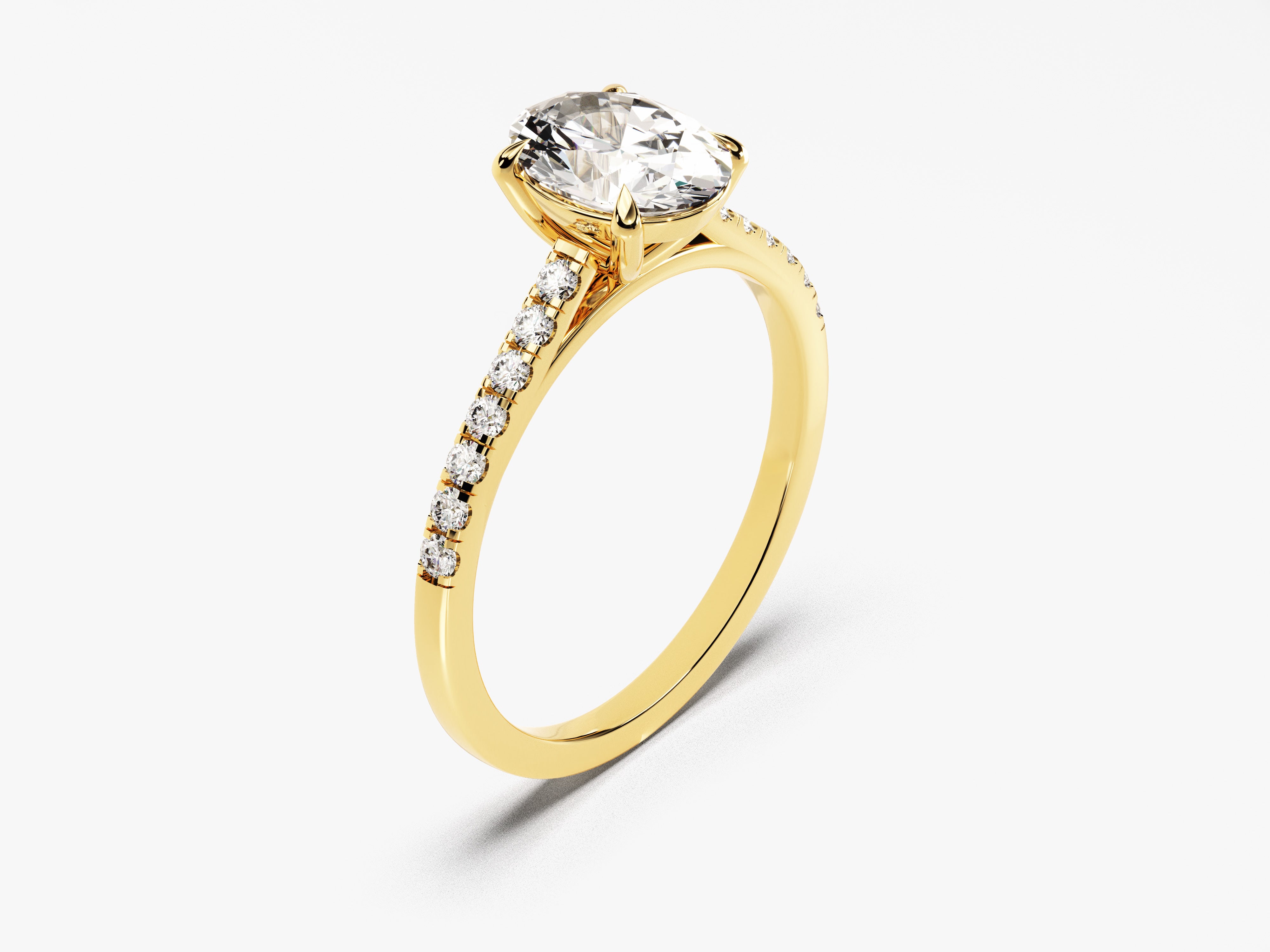 Gold oval diamond engagement ring with pave band