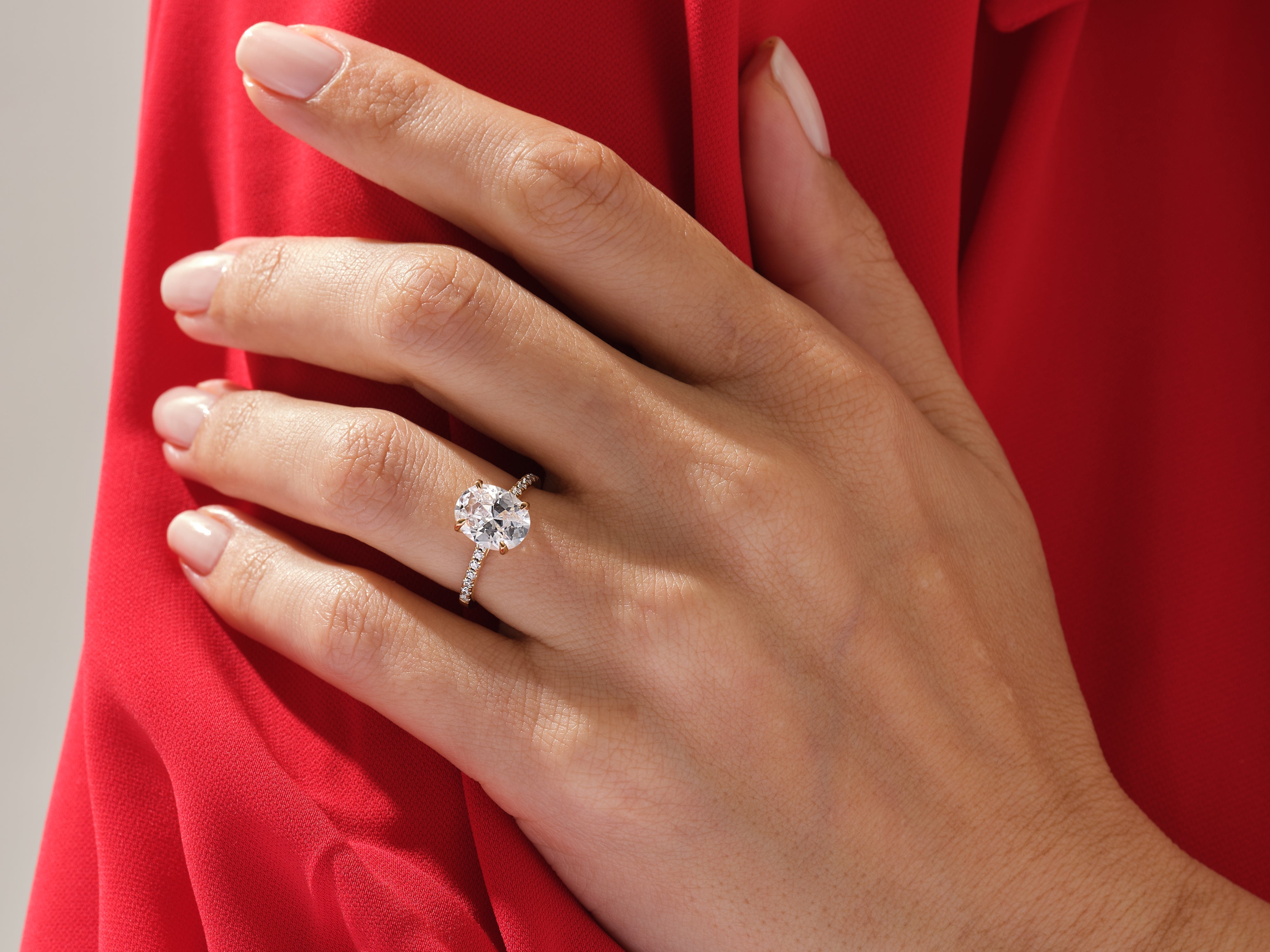 Diamond engagement ring on a hand, jewelry product photography