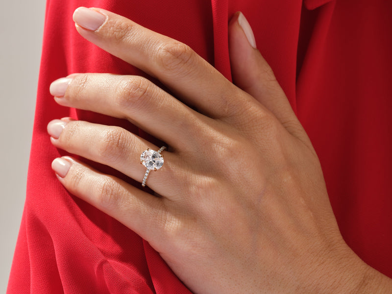 Diamond engagement ring on a hand, jewelry product photography