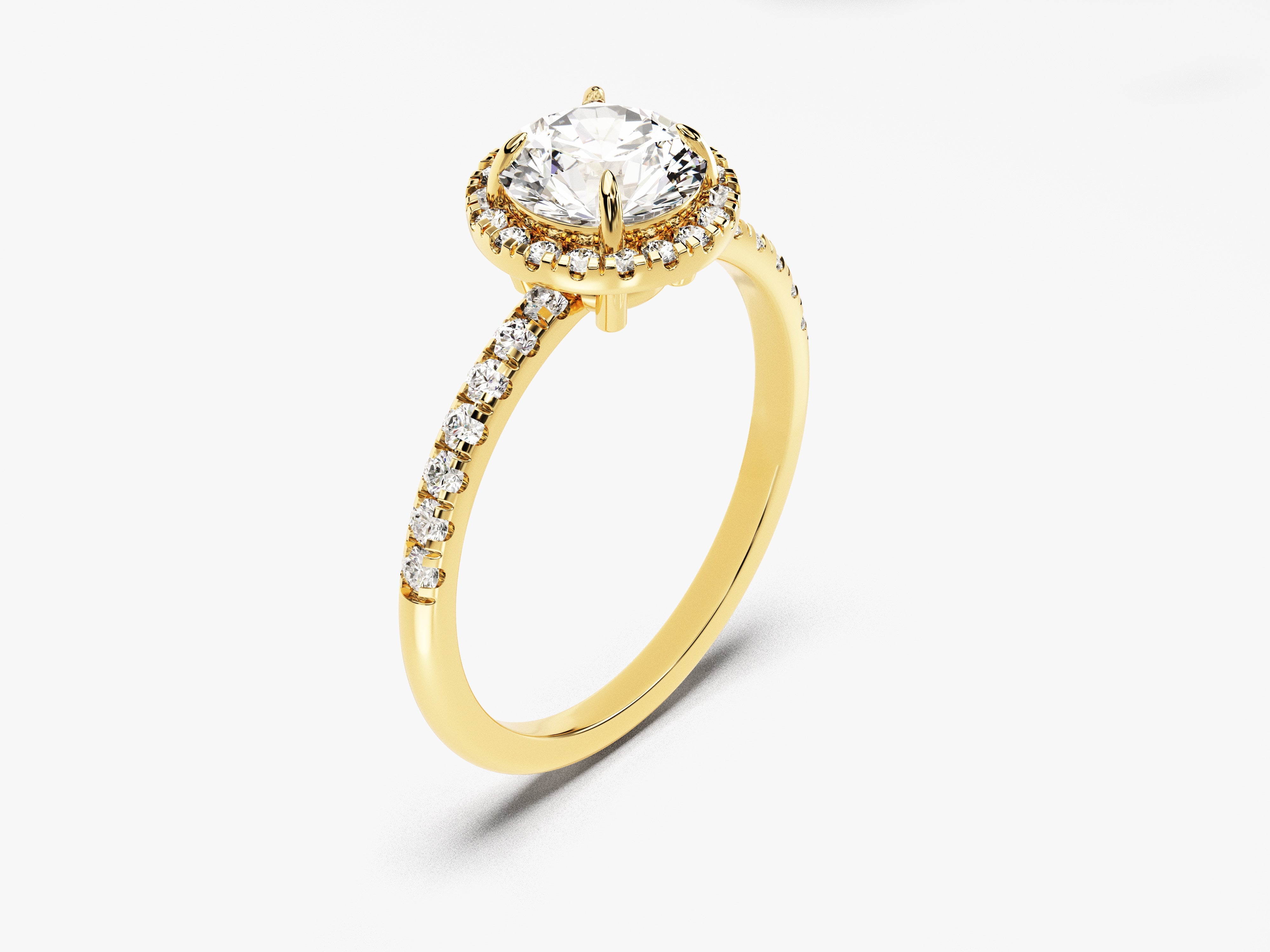 Gold diamond halo engagement ring with pavé band