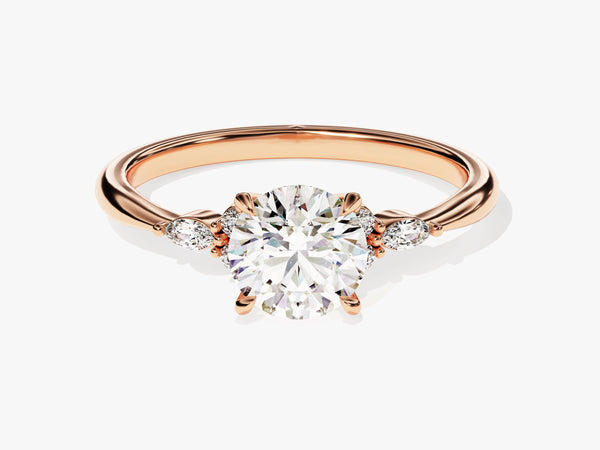 Rose gold diamond engagement ring with pear-shaped side stones
