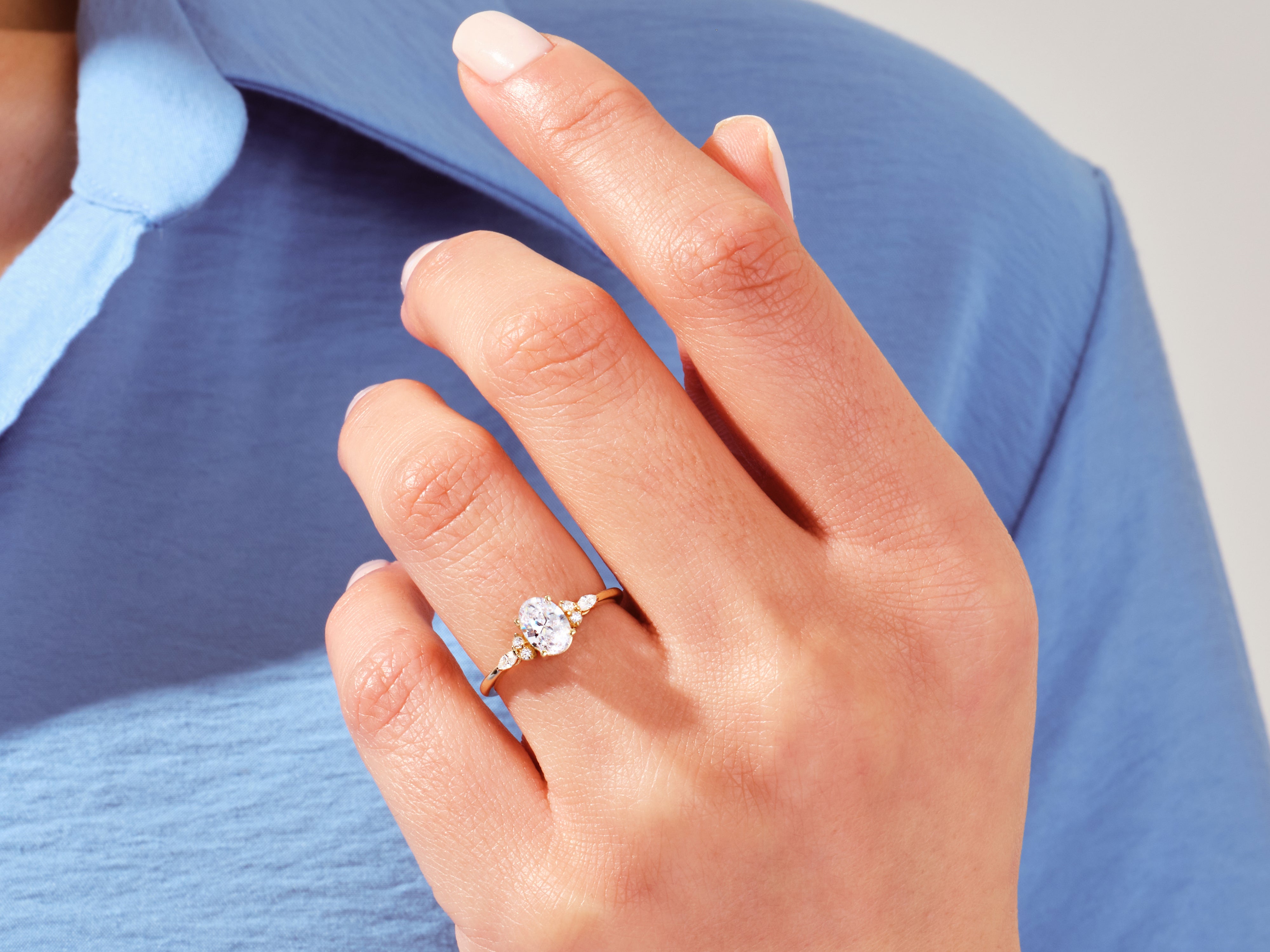 Oval diamond engagement ring on a woman's hand