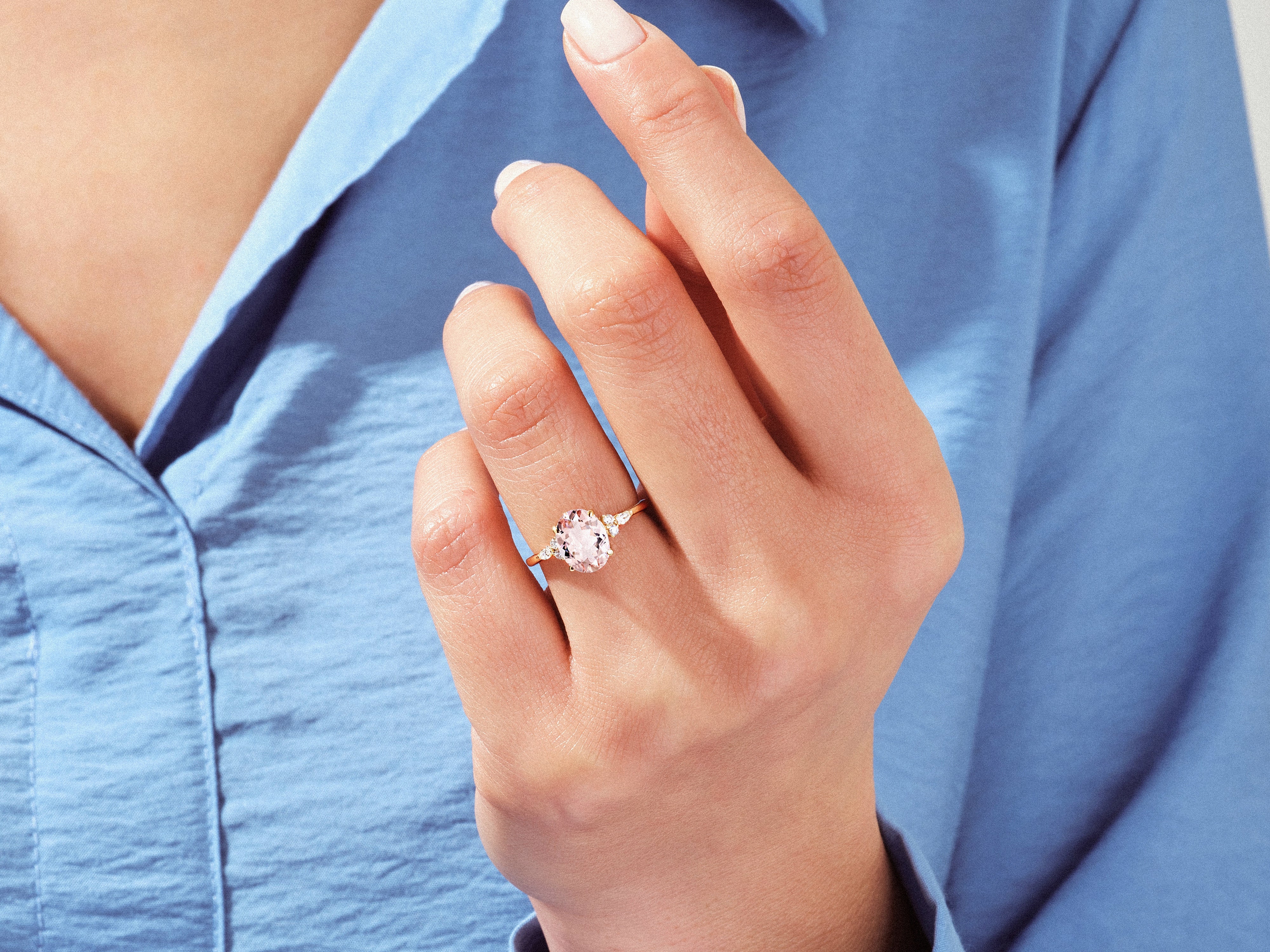 Elegant rose gold ring with pink gemstone and diamonds on a hand
