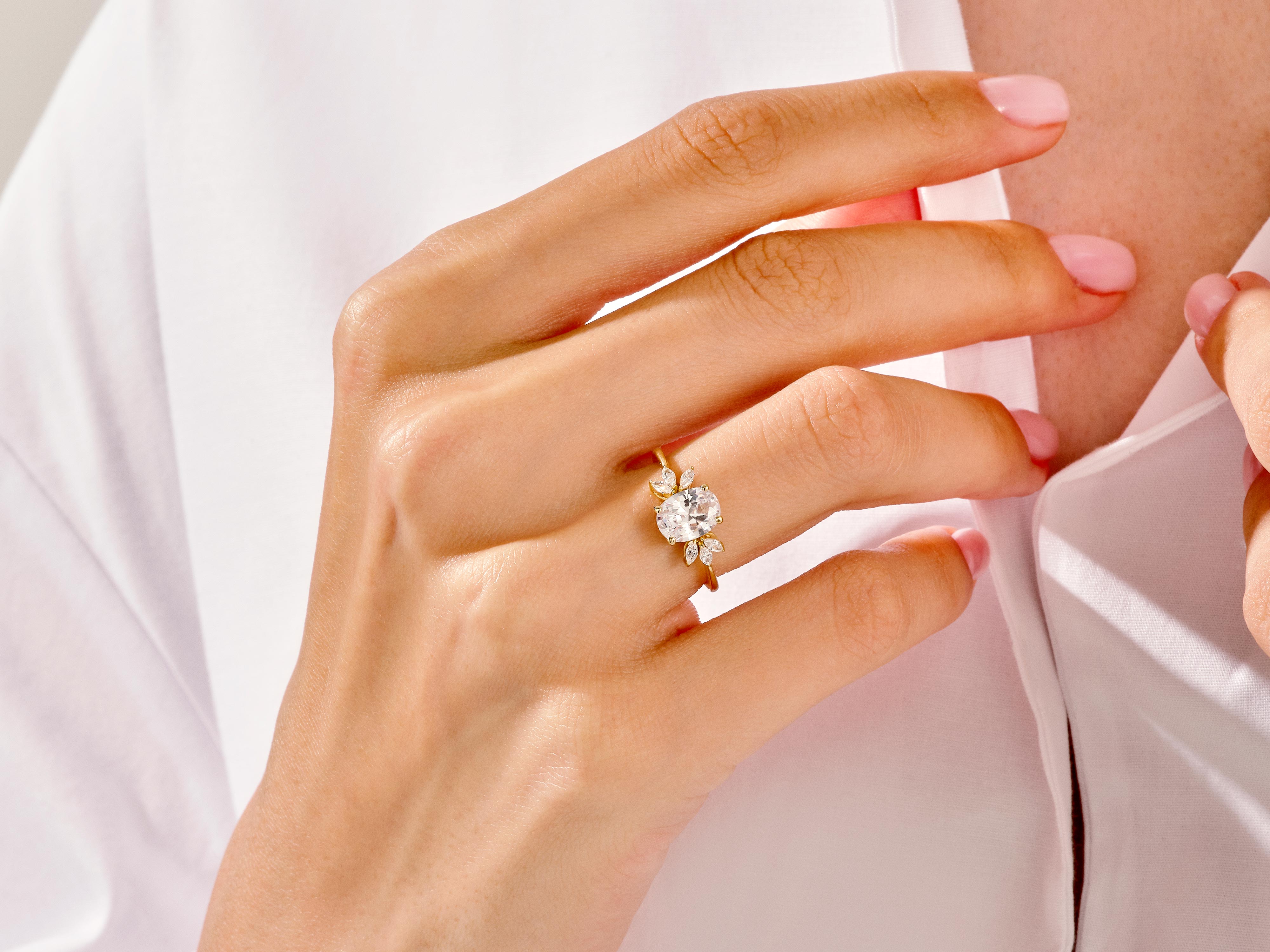 Oval diamond engagement ring on a woman's hand