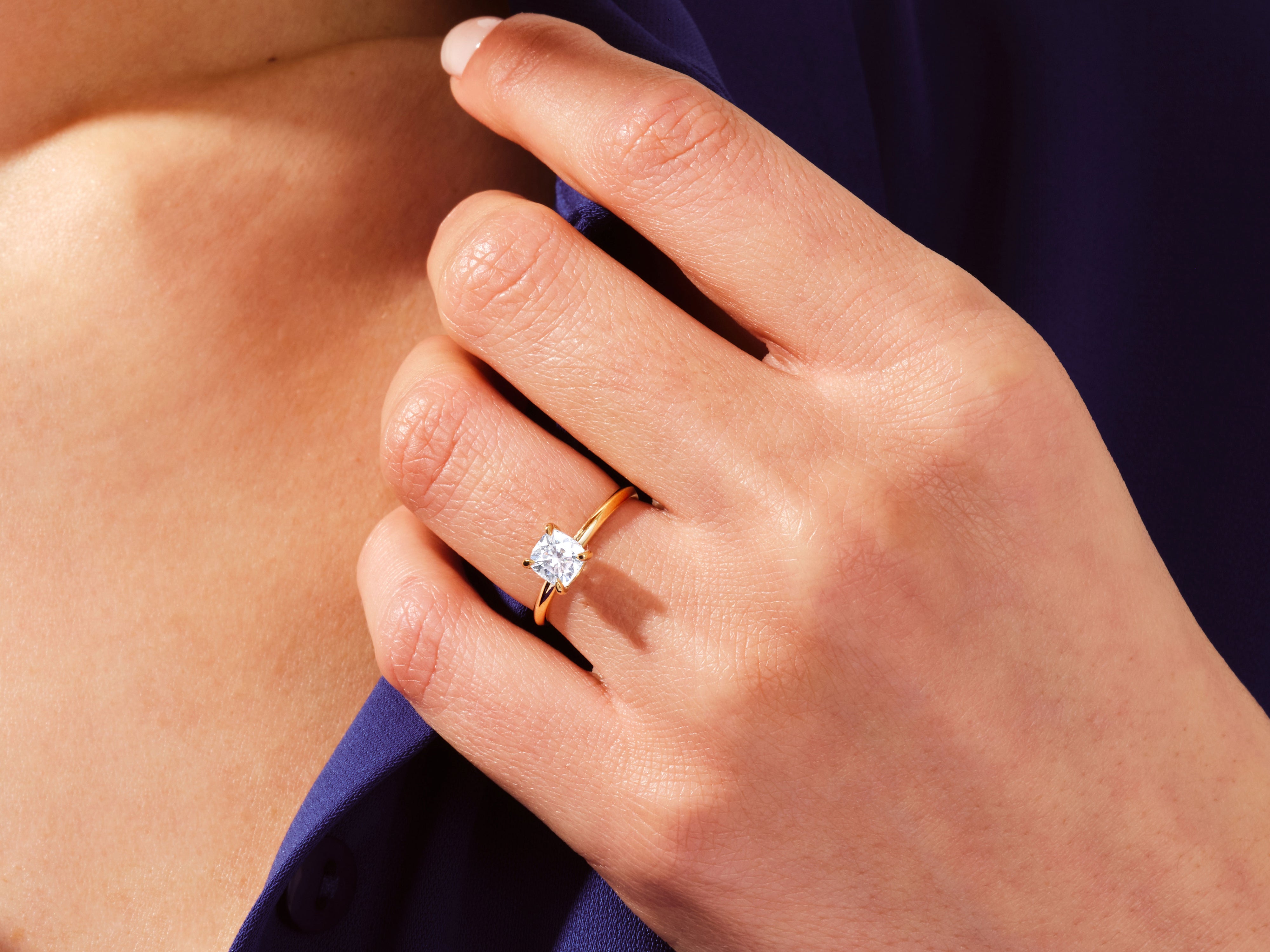Gold ring with square diamond on hand, jewelry photography