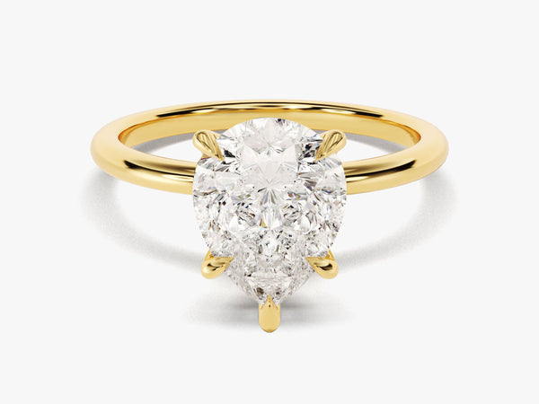 Pear cut diamond engagement ring in yellow gold