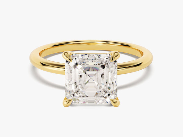 Emerald cut diamond engagement ring in yellow gold