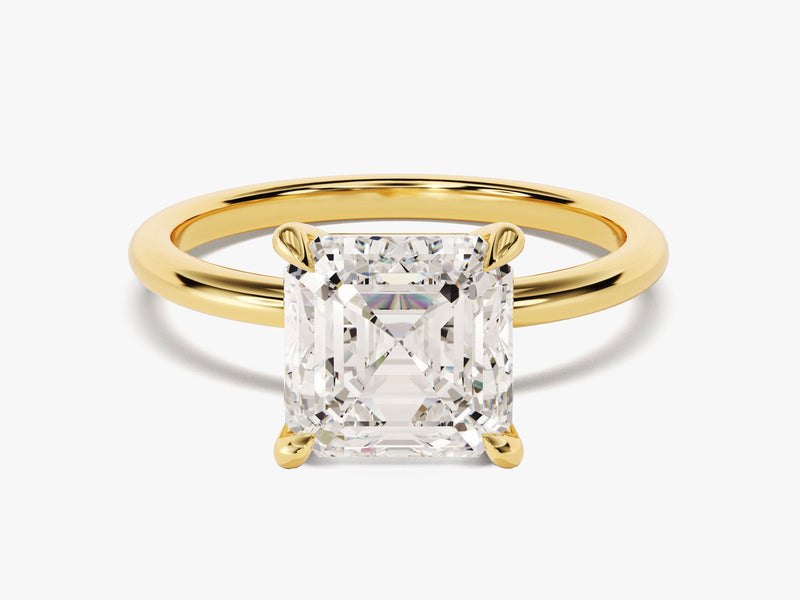 Emerald cut diamond engagement ring in yellow gold