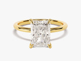 Radiant cut diamond engagement ring in yellow gold