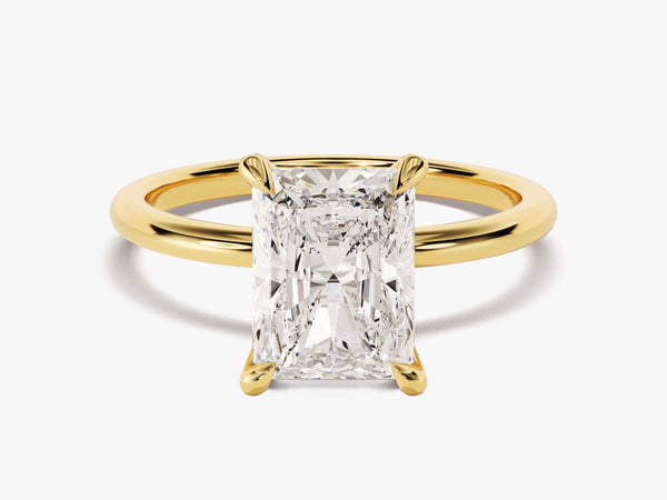 Radiant cut diamond engagement ring in yellow gold