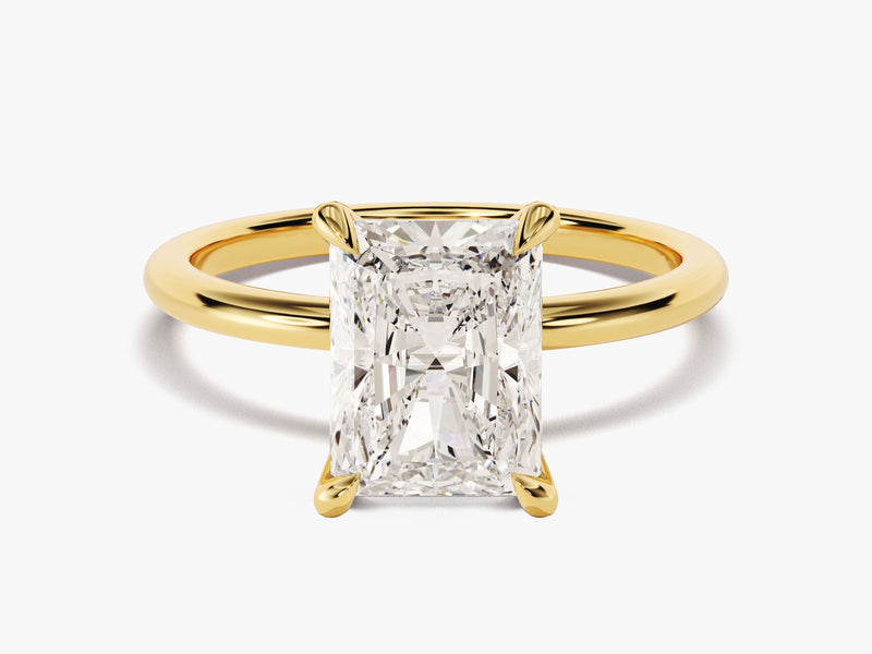 Radiant cut diamond engagement ring in yellow gold