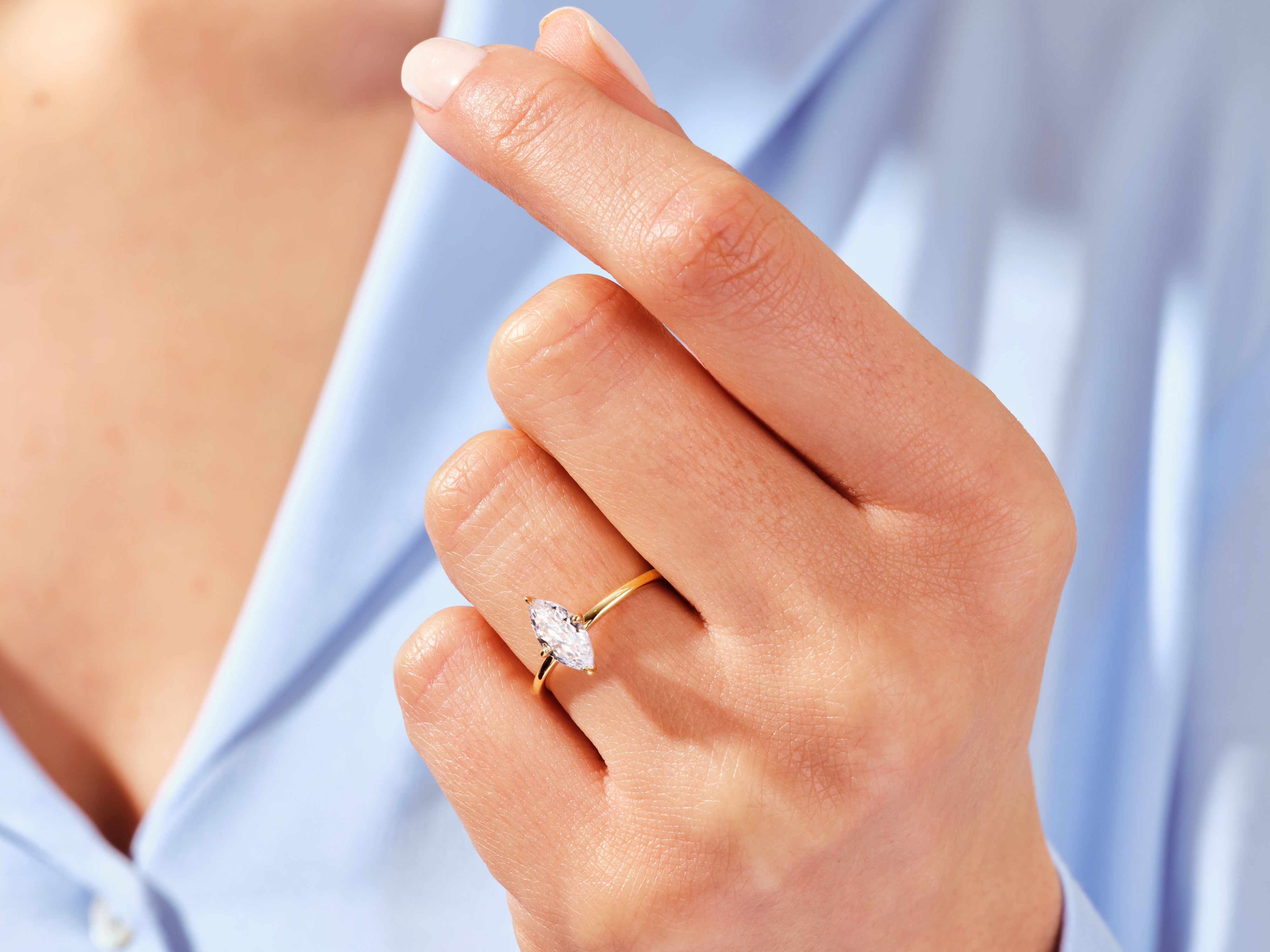 Marquise diamond engagement ring on a woman's hand