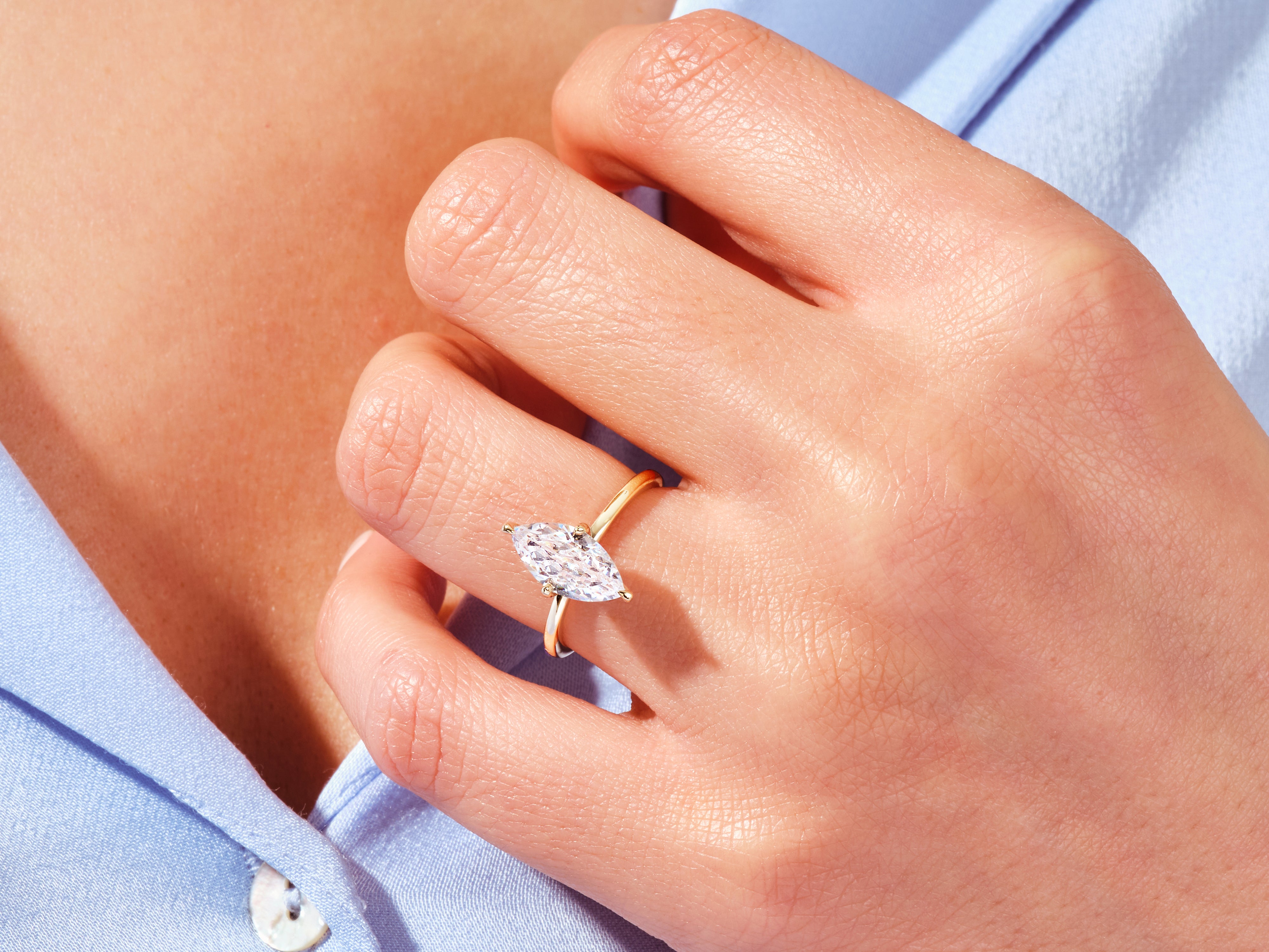 Marquise diamond engagement ring on a hand
