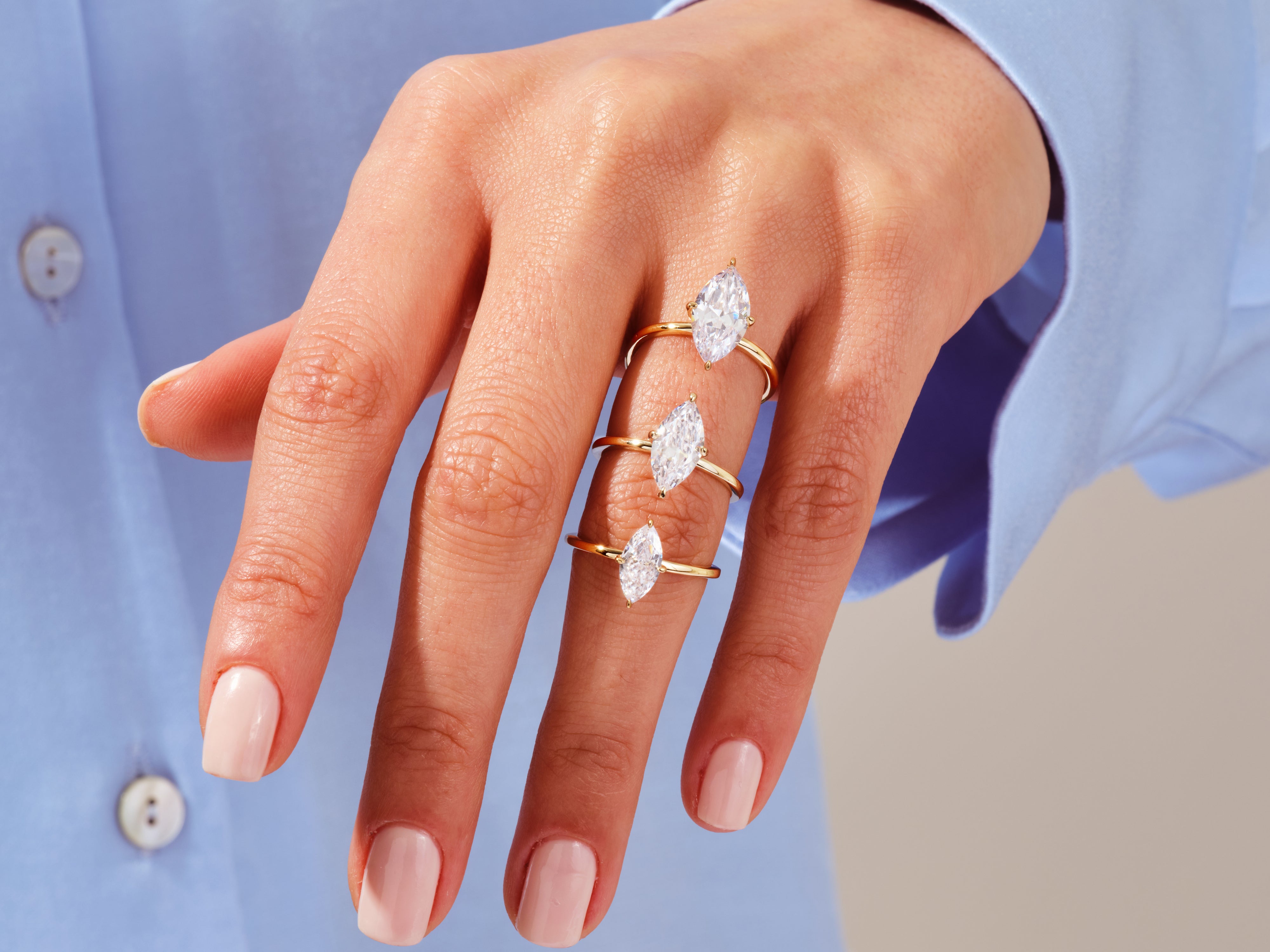 Diamond marquise rings on a hand, jewelry product photography