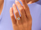 Gold diamond engagement ring on a woman's hand
