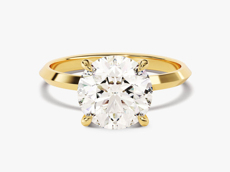 Oval diamond engagement ring in yellow gold