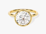 Oval diamond engagement ring in a gold bezel setting