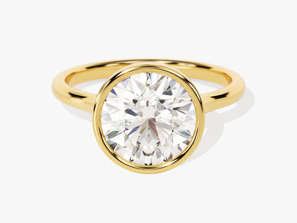 Oval diamond engagement ring in a gold bezel setting