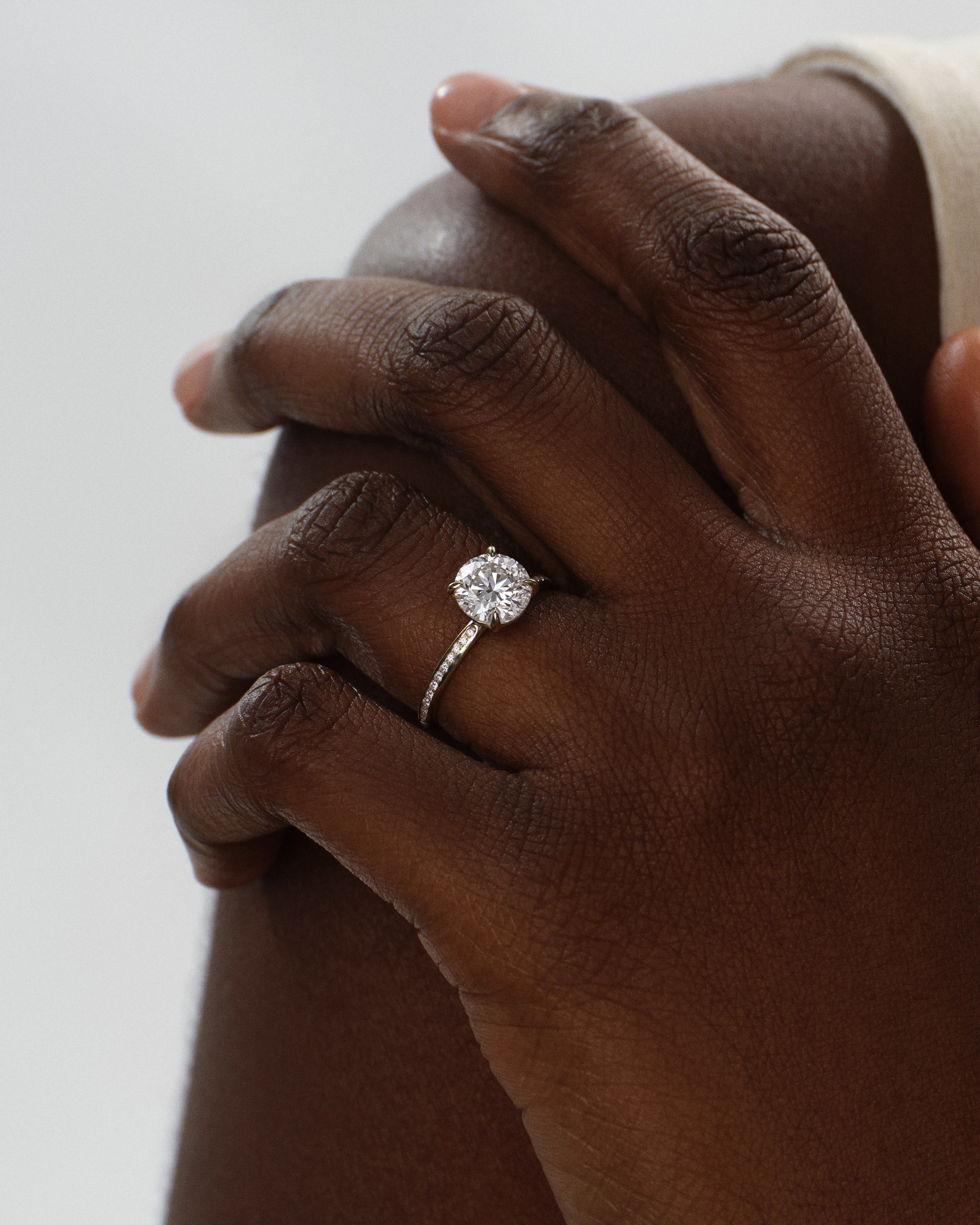 Round Cut Moissanite Engagement Ring with Channel Set Sidestones (1.00 CT)
