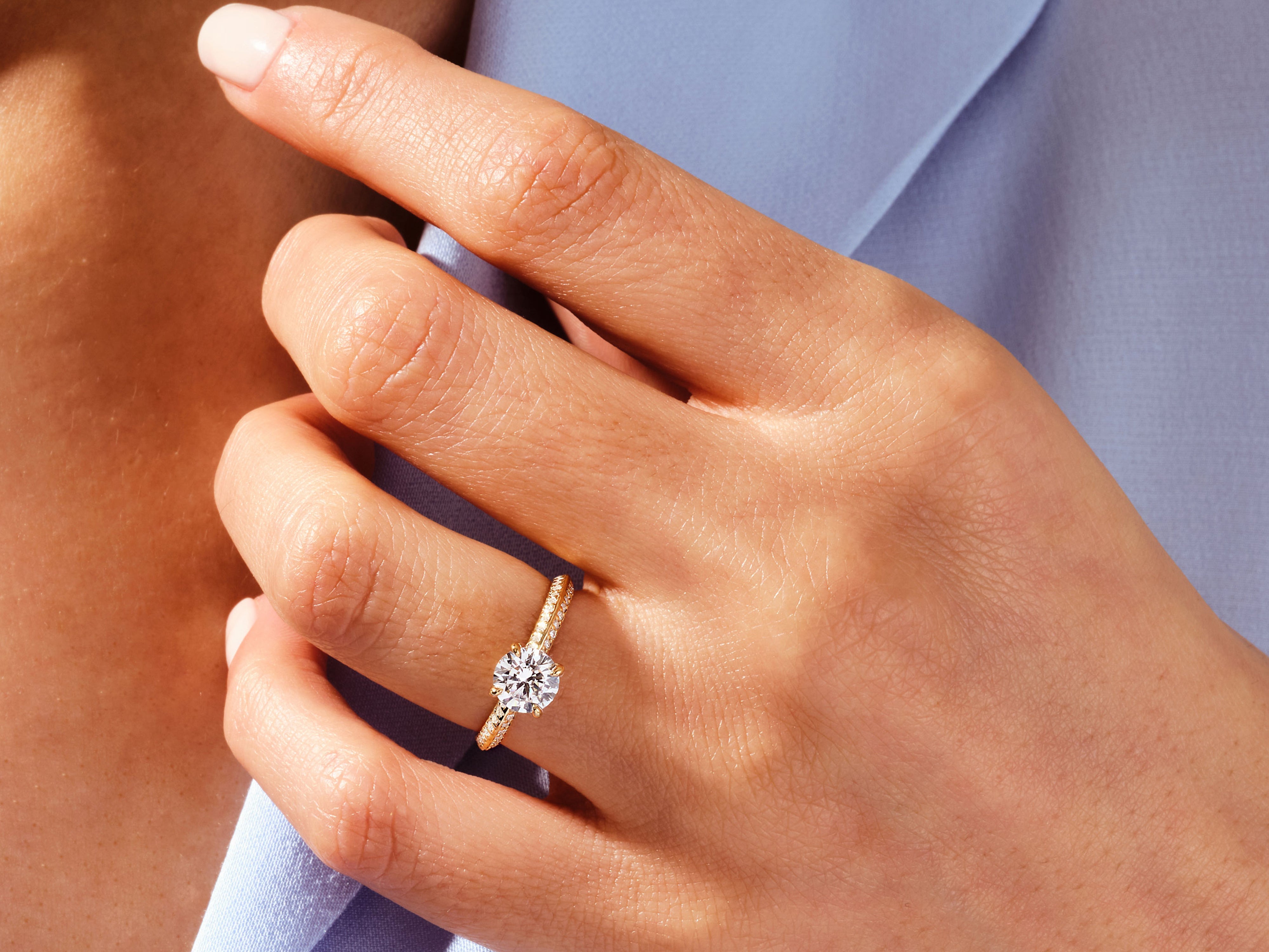 Diamond engagement ring on a woman's hand, jewelry photography