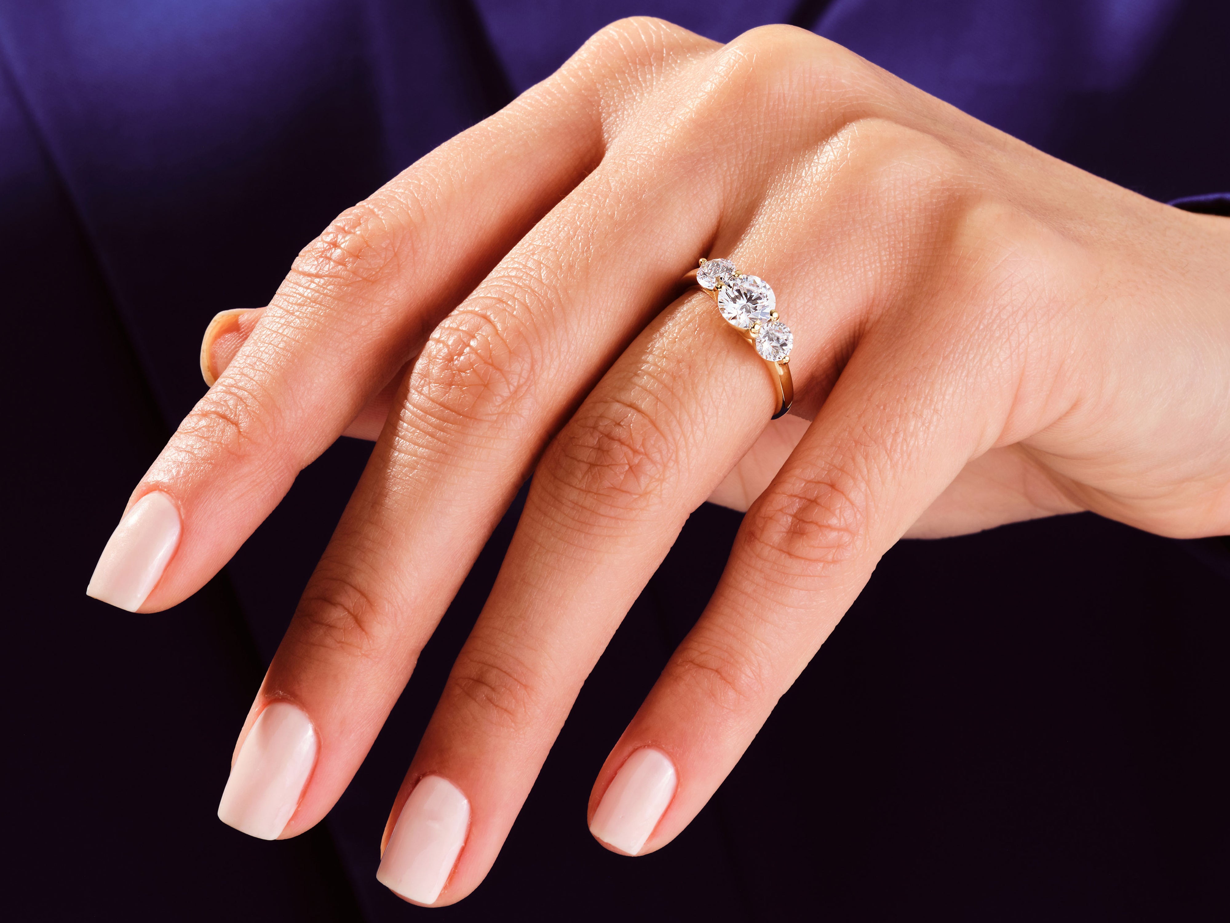 Diamond engagement ring on a woman's hand, jewelry photography
