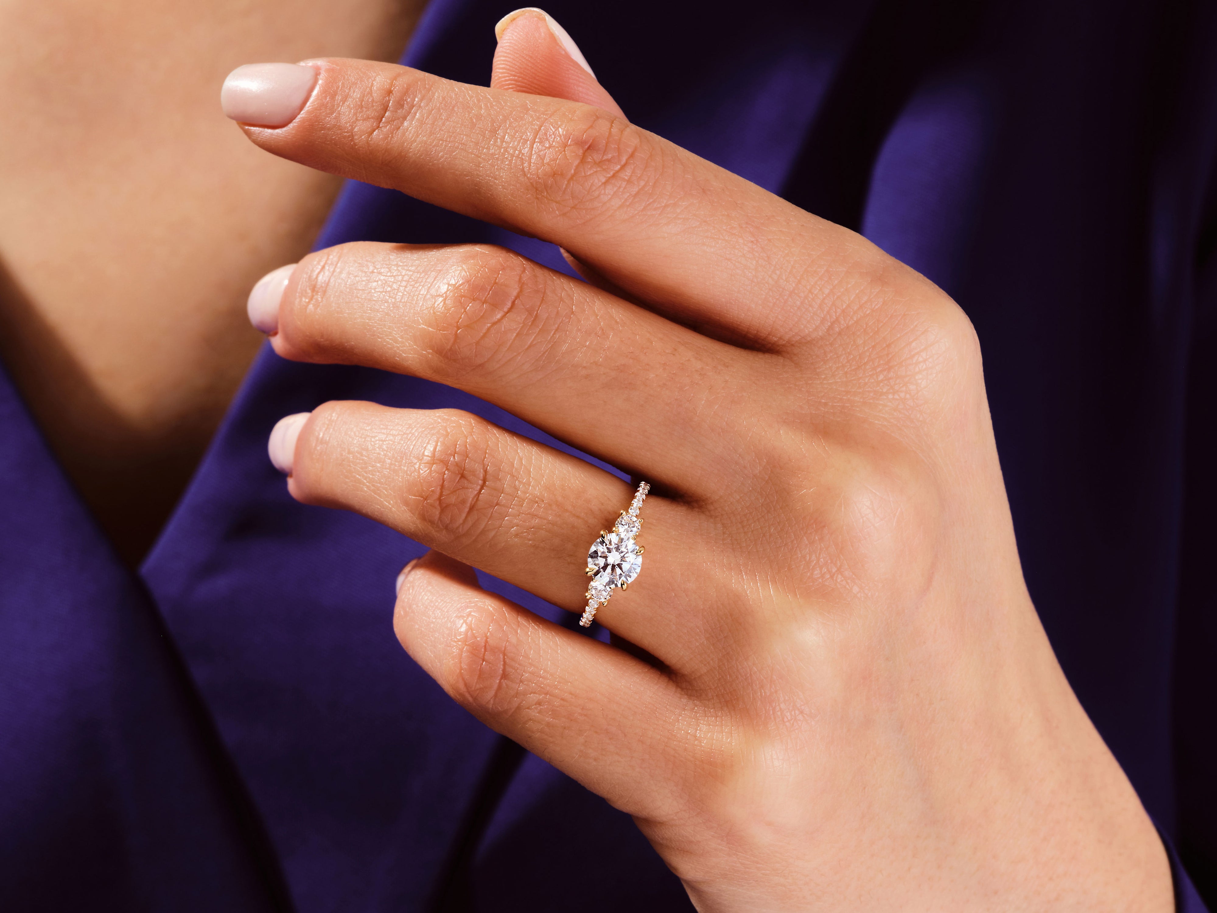 Diamond engagement ring on a woman's hand, jewelry product photography