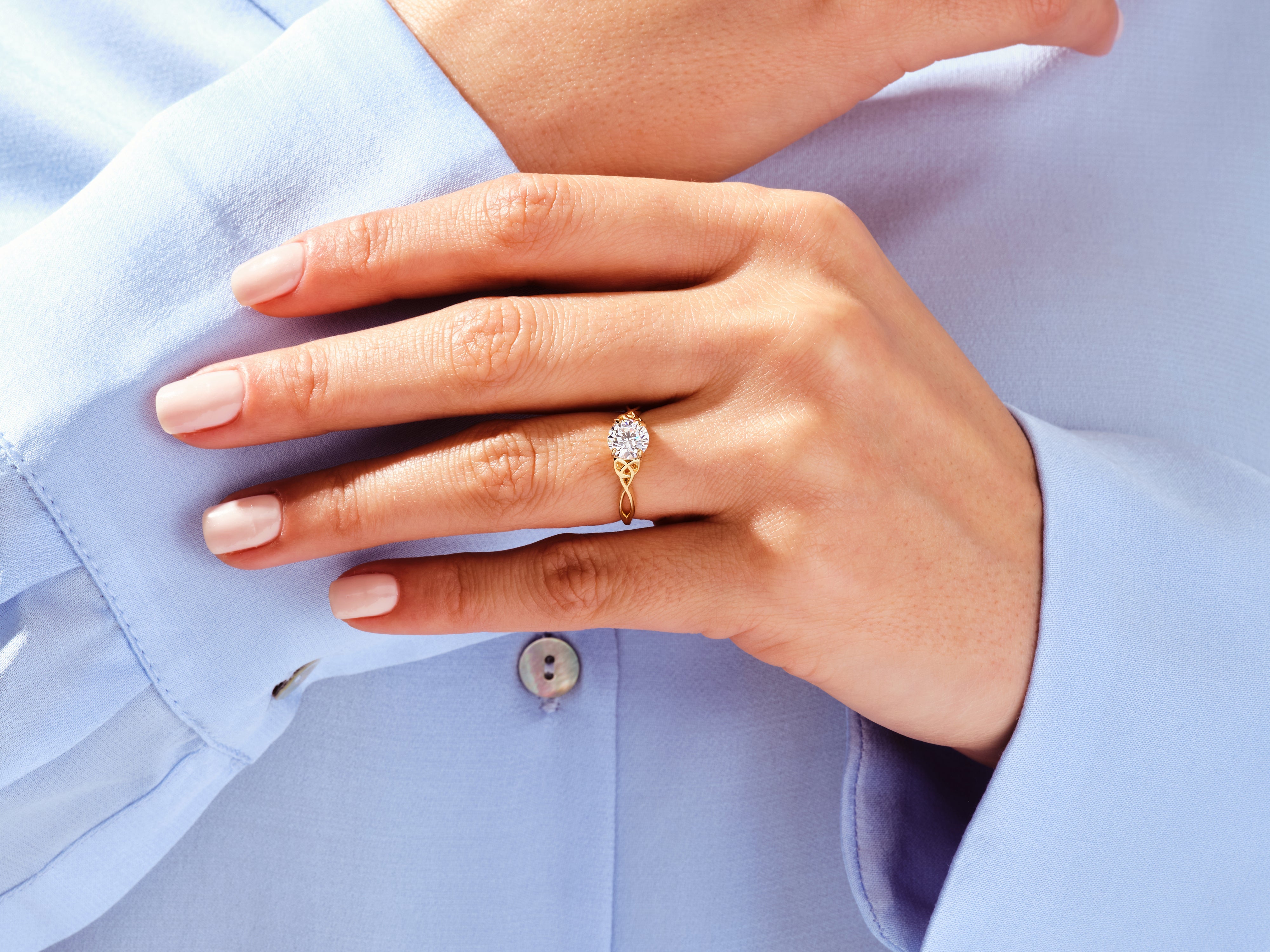 Gold diamond ring on hand, jewelry product photography