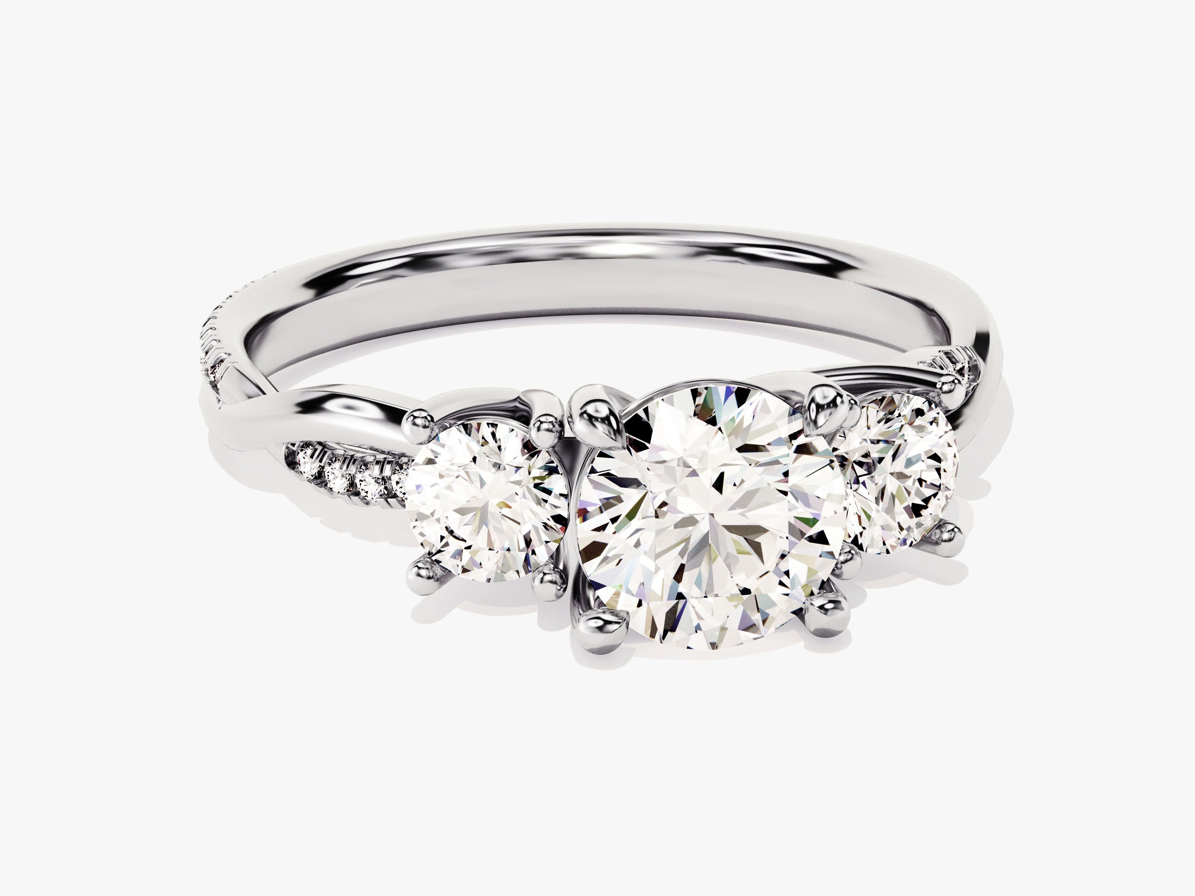 Three-stone diamond engagement ring with pave band