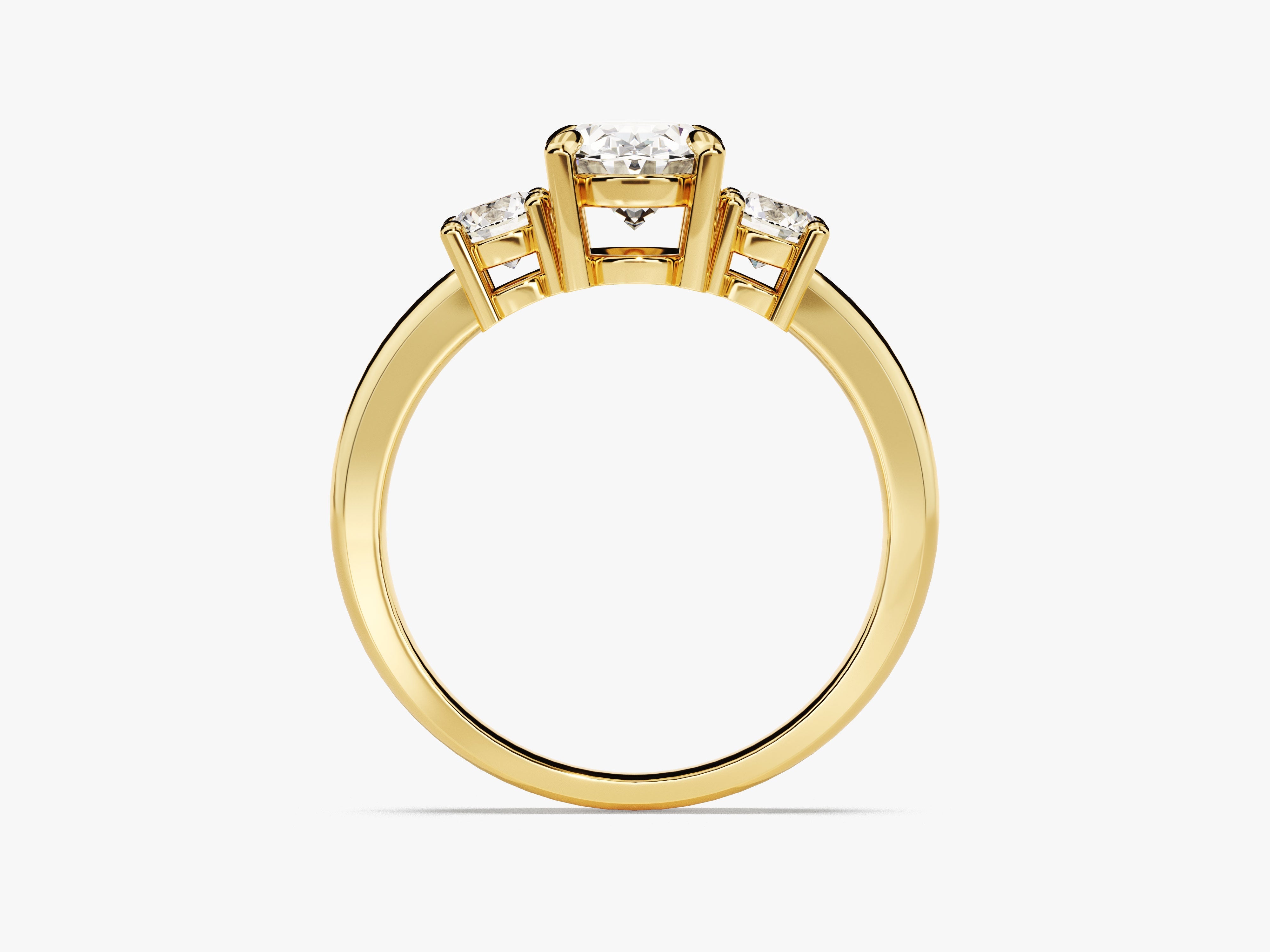 Three stone diamond engagement ring in yellow gold