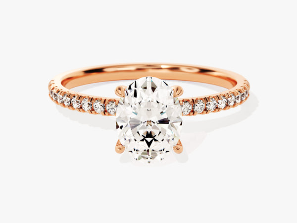Oval diamond engagement ring with rose gold band and accent diamonds
