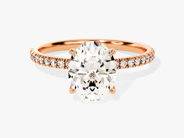 Oval diamond engagement ring with rose gold band and diamonds